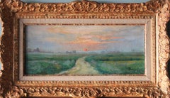 Antique landscape oil painting of a setting sun by Ernest Gaston Amas