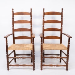Ernest Gimson. A pair of yew wood ladder back and bobbin turned armchairs