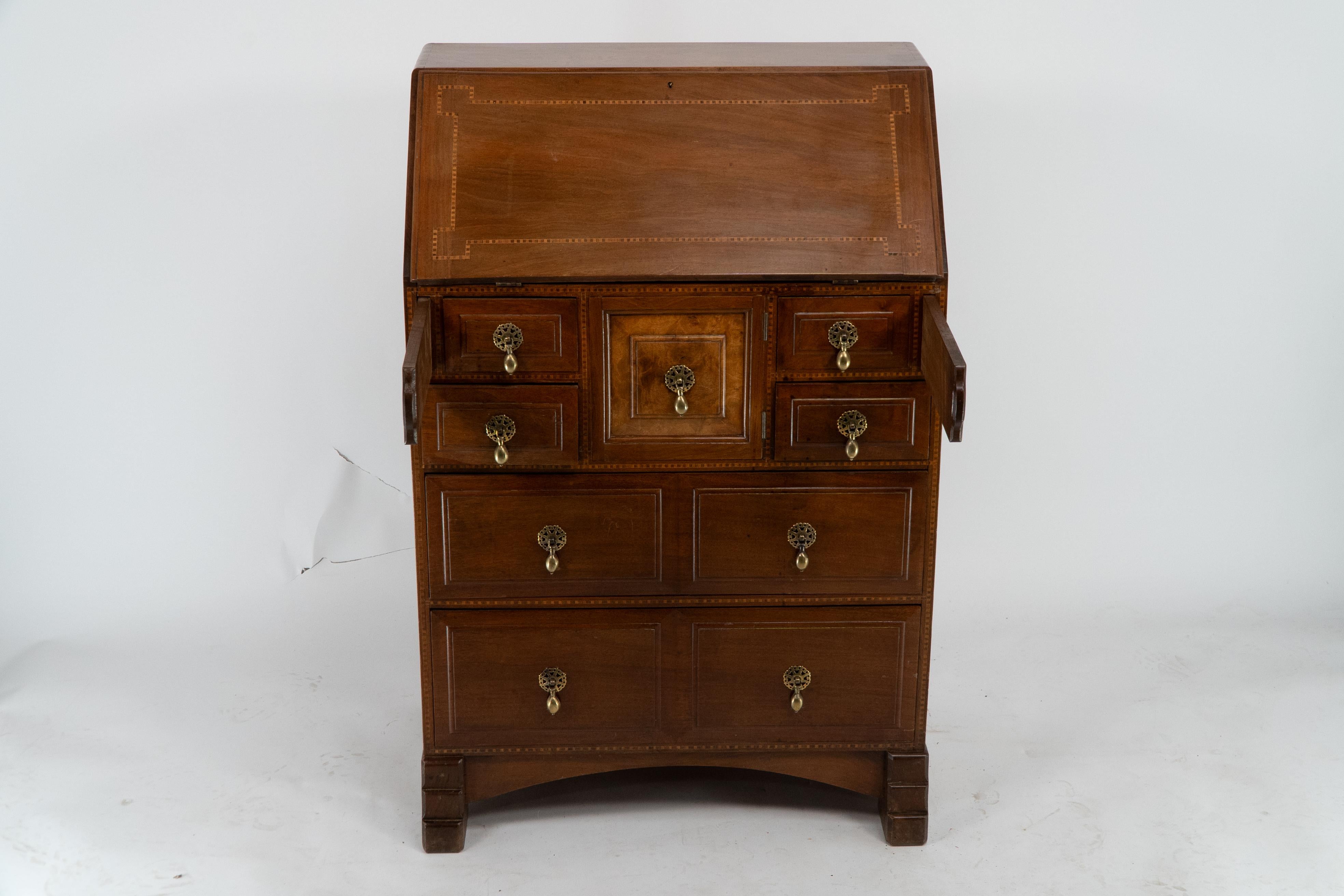 Ernest Gimson attributed. Arts & Crafts Cotswold school walnut bureau inlaid with holly chequered string inlay. The quality of this craftsman handmade bureau is a step above. The fold-down front is inlaid with holly chequered string inlay, opening