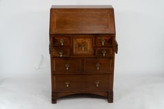 Ernest Gimson A walnut bureau inlaid with holly chequered string inlay.