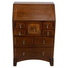 Antique Ernest Gimson A walnut bureau inlaid with holly chequered string inlay.