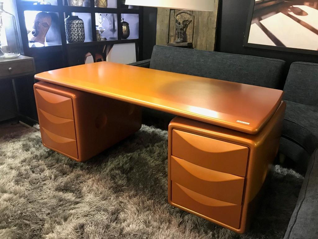 Futuristic and legendary, this highly collectible desk by German (though born in Prague) artist and modern designer Ernest Igl is simply awe-inspiring and a must-have for collectors and connoisseurs of modern furniture. 

Originally produced in