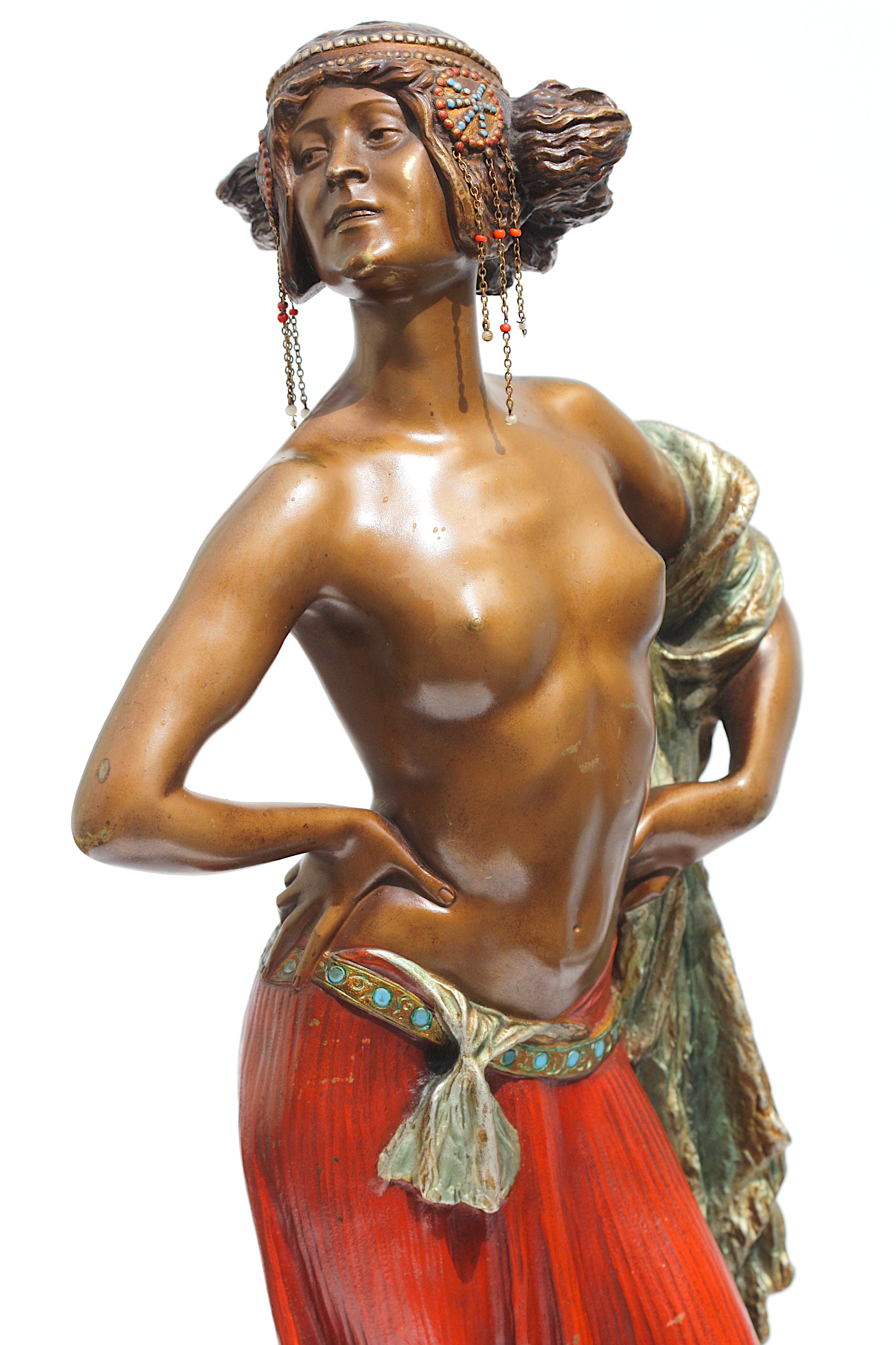 
Ernest Serger, (German/Austrian, 1840-1917) 
Bronze Salome, Circa 1890. Signed E. Seger. Poised proudly, her upper torso exposed, she holds a shawl and wears a red skirt, on a circular base, atop an onyx plinth.
Height 21 in. (53.34 cm.), Width