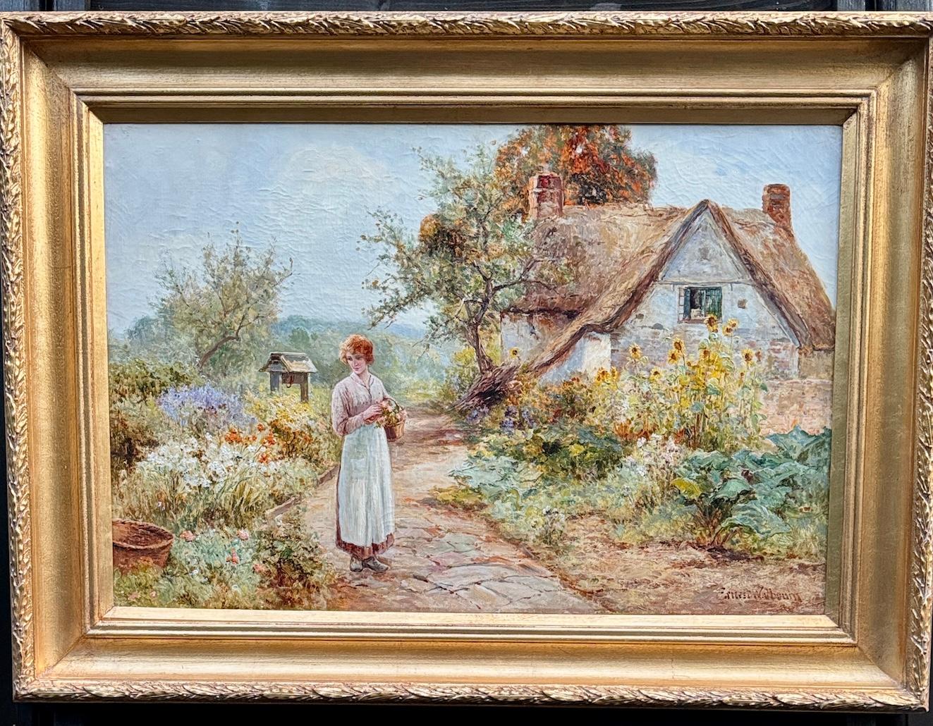 Casa de campo inglesa victoriana de principios del siglo XX Jardín con mujer con flores en venta 7