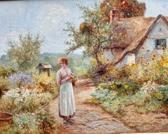 English Victorian early 20th century cottage Garden with woman with flowers