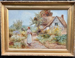 English Victorian early 20th century cottage Garden with woman with flowers