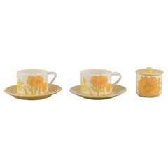 Vintage Ernestine Salerno. Two large coffee cups with saucers and a lidded jar.