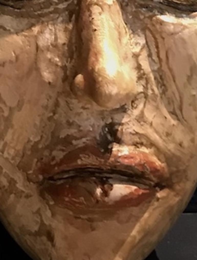 Sculpture is Capdevila's favorite form of visual communication. He works with found materials, in this case-wood from a discarded table, and creates a highly evocative work. An expressionistic female head with a flower growing out of the fontanelle.