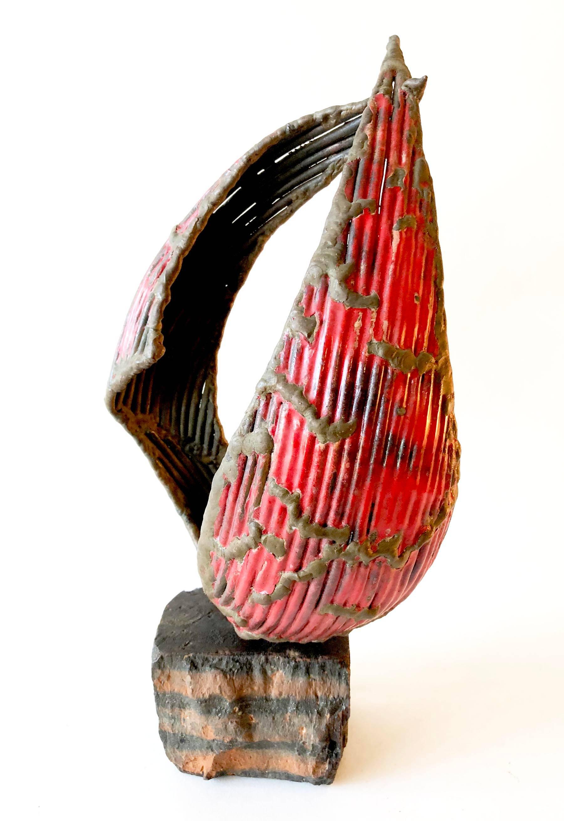 Bronze, one of a kind sculpture created by Cuban modernist sculptor Ernesto Gonzalez. Sculpture has a textured, patinated finish and sits within a brick base which was hand torched by the artist. Sculpture measures 14