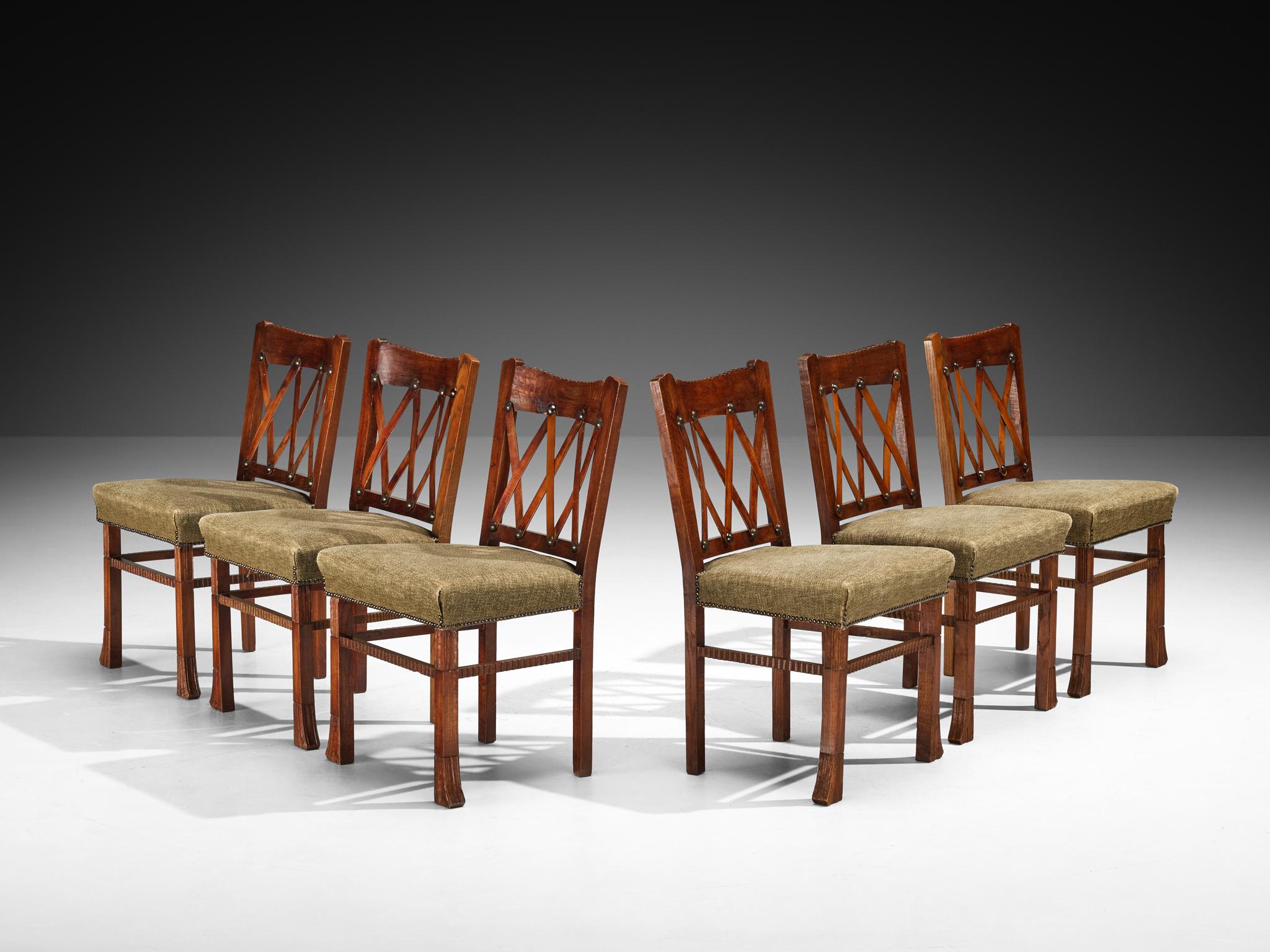 Ernesto Valabrega for Vittorio Valabrega, set of six dining chairs, oak, beech, fabric, Italy, 1930s

Designed by Ernesto Valabrega for Vittorio Valabrega in the 1930s, this set of dining chairs is a fine example of Italian craftsmanship from the