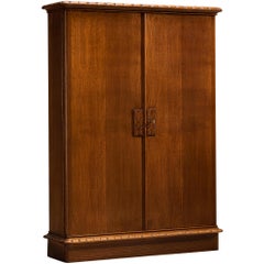 Ernesto Valabrega per Vittorio Valabrega Armadio alto in rovere massiccio intagliato