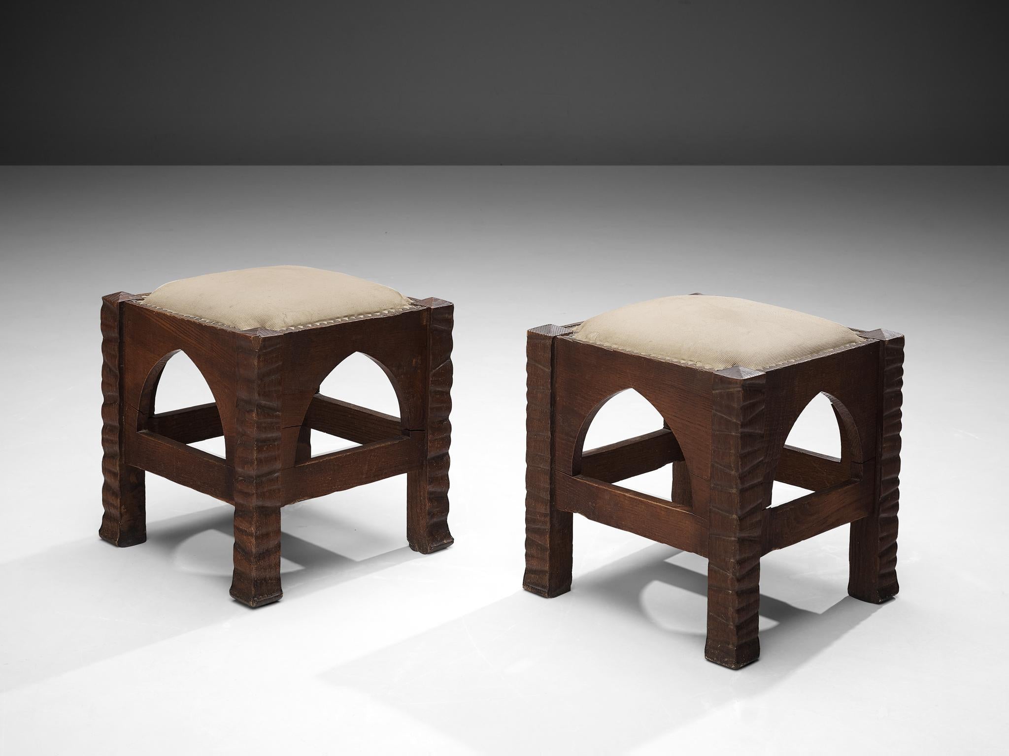 Ernesto Valabrega, pair of ottomans, oak, brass, fabric, Italy, ca. 1935

Ernesto Valabrega designed a rather particular ottoman. In between the legs one pointed arch each decorates the design. The legs are structured by a relief of unsymmetric