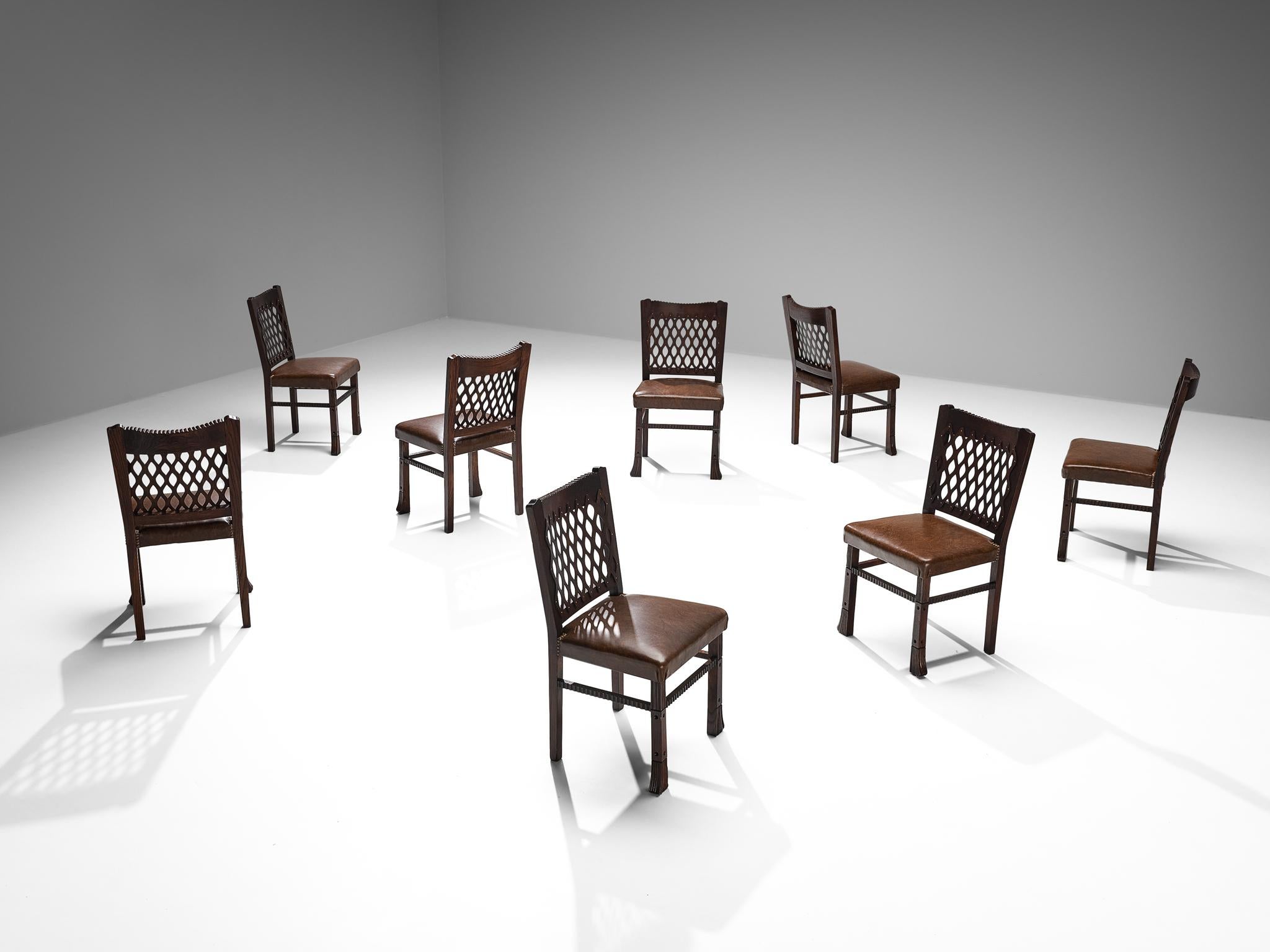 Ernesto Valabrega, set of eight dining chairs, oak, leather, metal, Italy, circa 1935

These well-sculpted chairs are created in one of the most influential periods for the arts namely the Art Deco Movement. The chairs bear witness to the