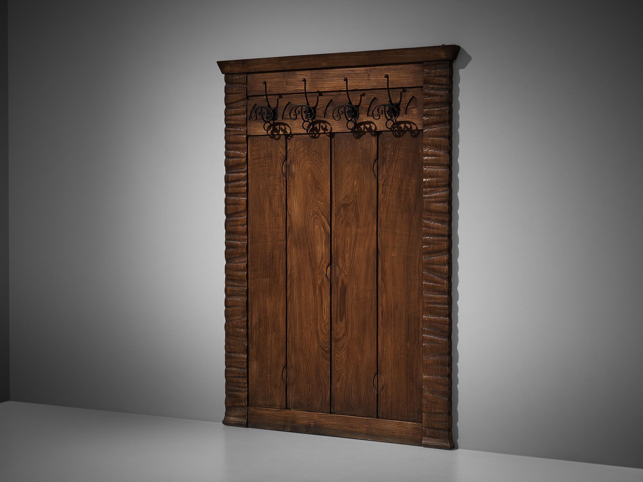 Ernesto Valabrega, coat rack, oak, iron, Italy, ca. 1935

Wall-mounted coat rack by Italian designer Ernesto Valabrega. This pieces features a decorated wooden wall on which four iron hangers are fixated. Typical for Valabrega's designs is the