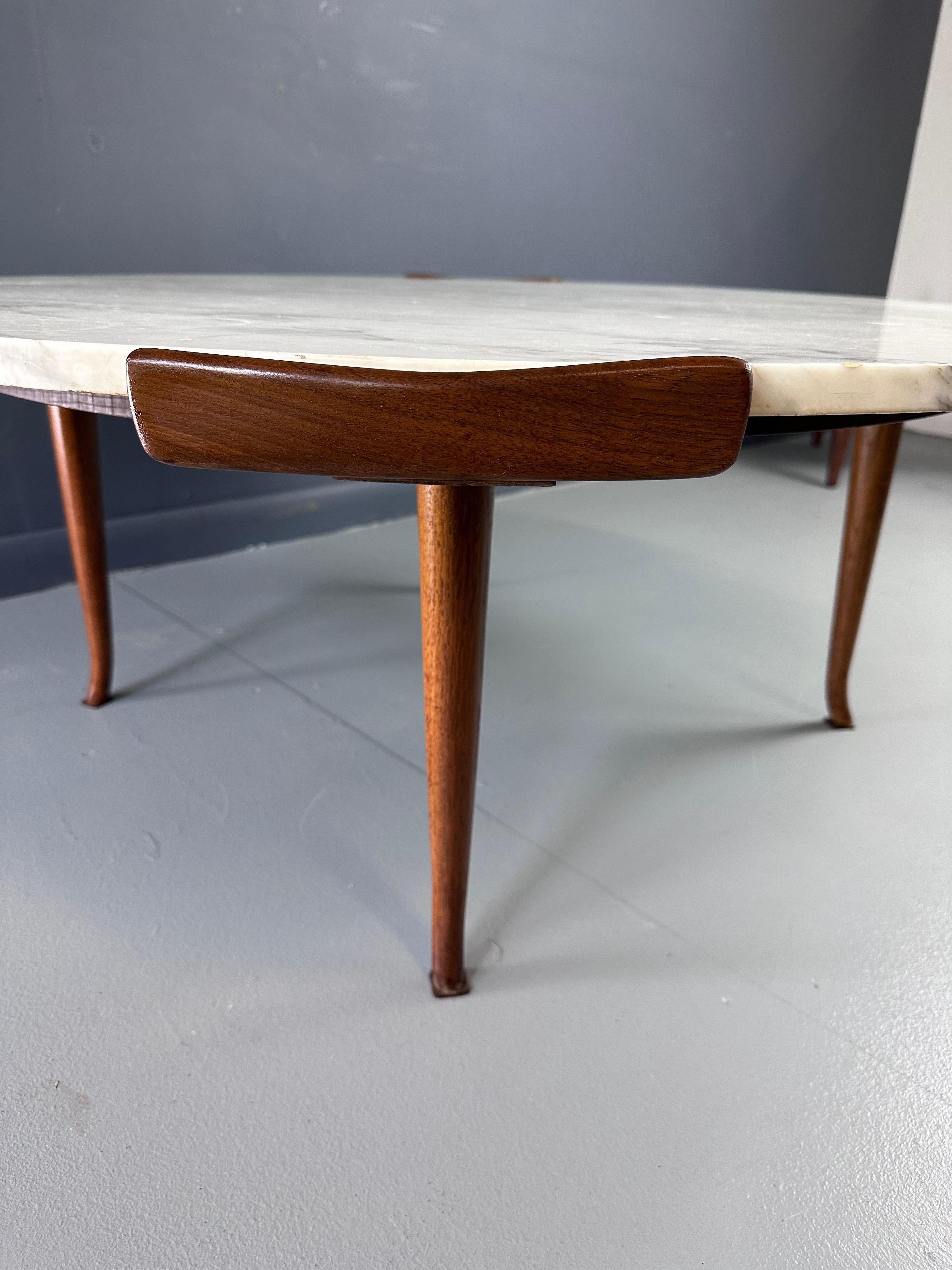 Erno Fabry Coffee Table in Carrara Marble and a Walnut Base with Curvacrous Legs In Good Condition For Sale In Philadelphia, PA