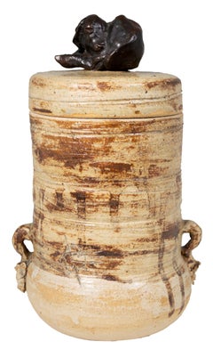 'Cover Jar with Lamb' signed stoneware jar with bronze lamb finial