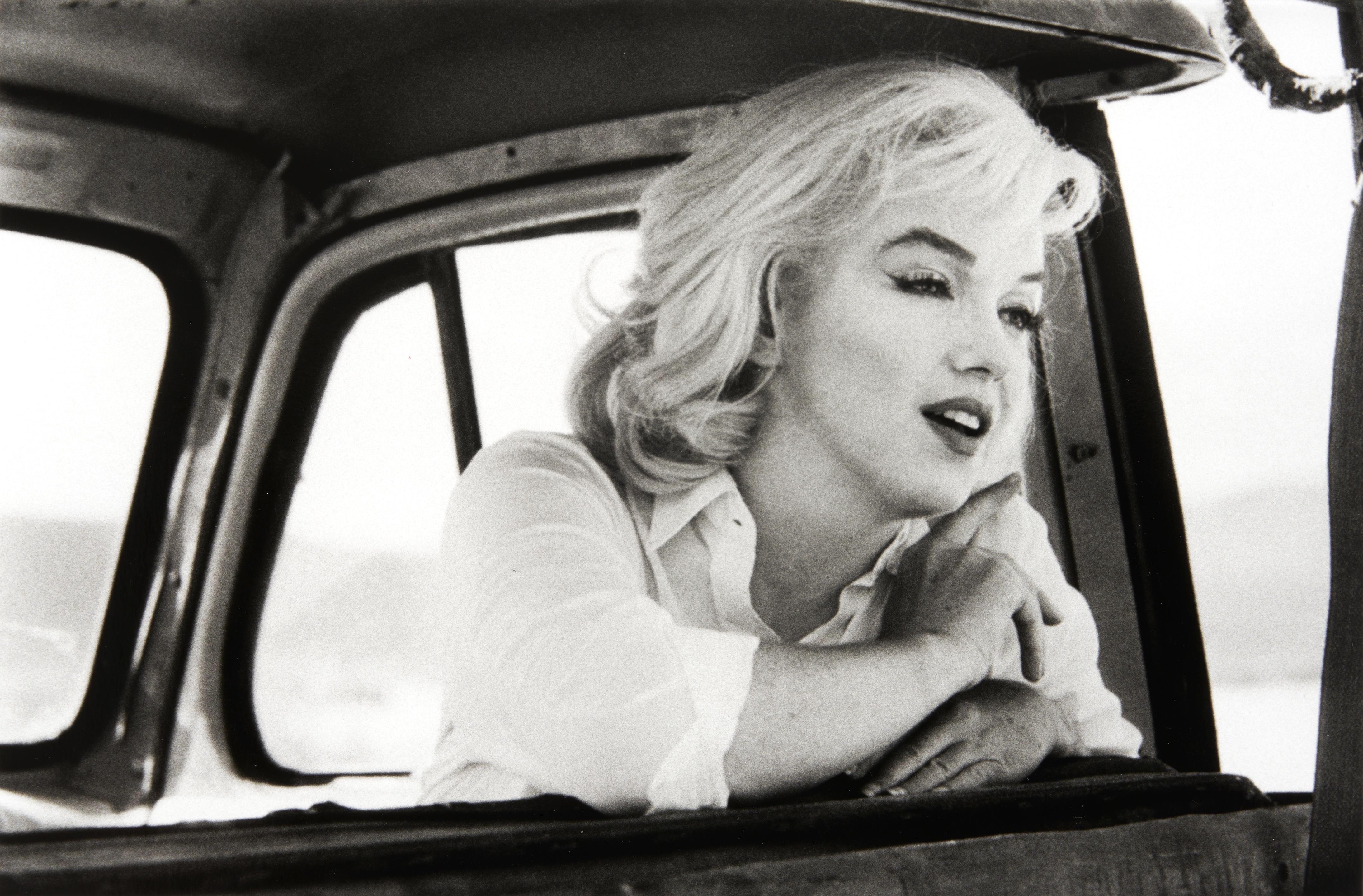 Ernst Haas Portrait Photograph - Marilyn Monroe in the Car Looking Forward