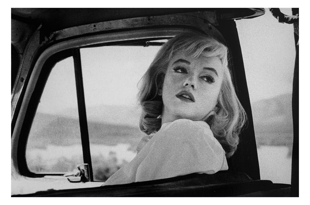 Ernst Haas Portrait Photograph - Marilyn Monroe Looking Back, Black and White Photography of Hollywood Star 1960s