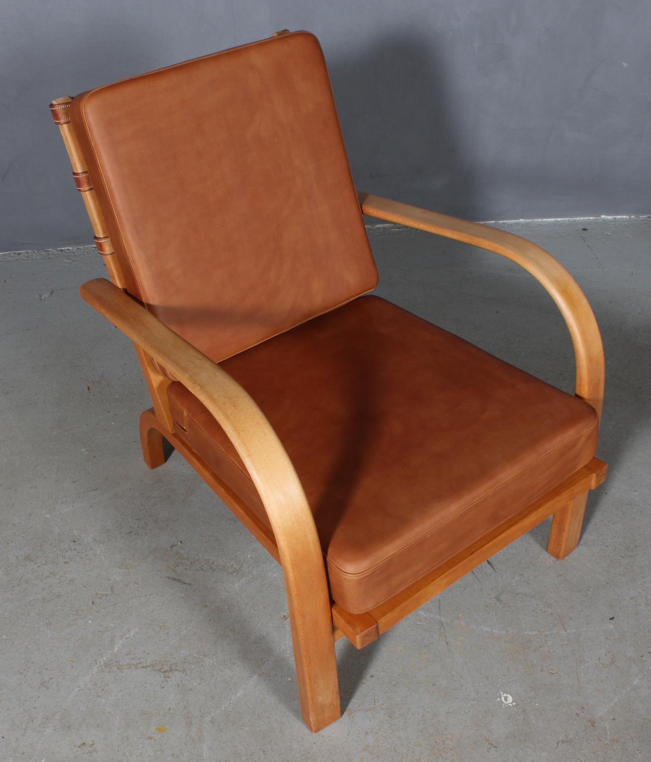 Ernst Heilmann Sevaldsen for Fritz Hansen lounge chair with frame of beech.

New upholstered with vintage tan aniline leather.

Original leather straps in the back.

Made by Fritz Hansen in the 1930s.