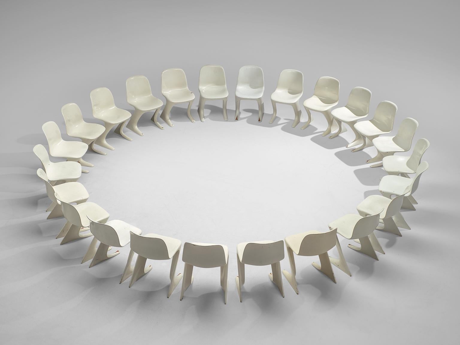 Ernst Moeckl for Trabant, Set of 24 'Z' chairs, fiberglass, Germany, 1968

This set of white Kangaroo chairs is designed by Ernste Moeckl in 1968. The chair is also called the Z-chair, referring to its shape. During the period of the Iron Curtain,