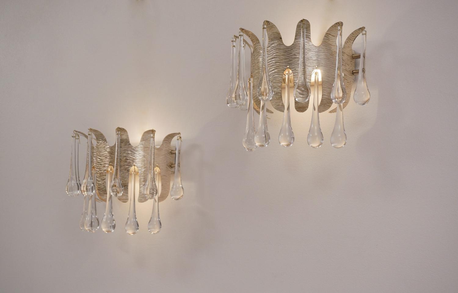 Ernst Palme wall lights for Palwa, a pair with silver plated frames & 26 crystals, 1960s, German.

This pair of wall lights has been thoroughly cleaned respecting the vintage patina. Both are newly rewired & earthed, in full working order & ready