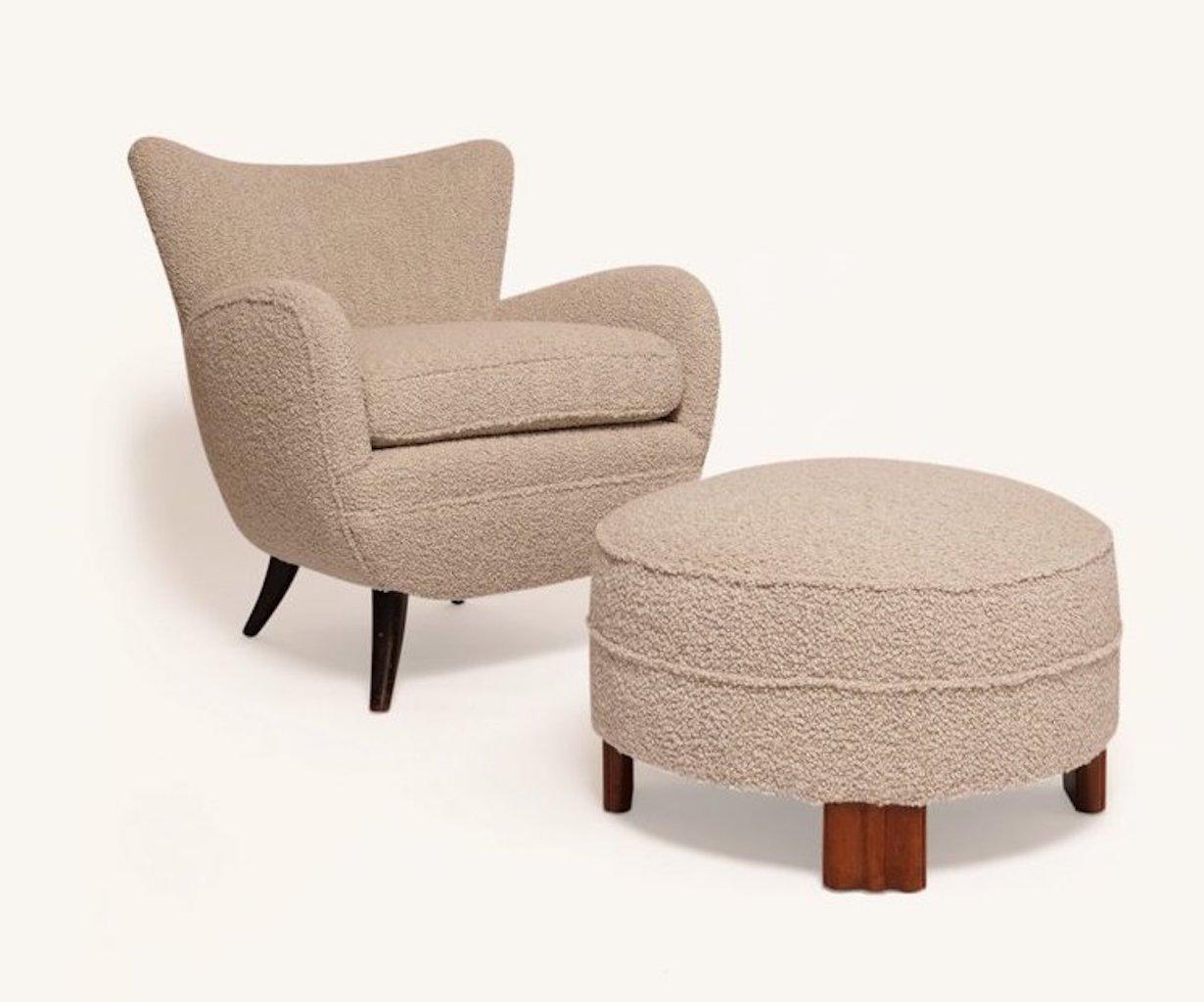 This boucle lounge chair designed by Ernst Schwadron and reupholstered by the Somerset House is indicative of the restrained Viennese modernist style typically seen in Austria during the 1930s. Schwadron’s interior designs, furniture and lamps were