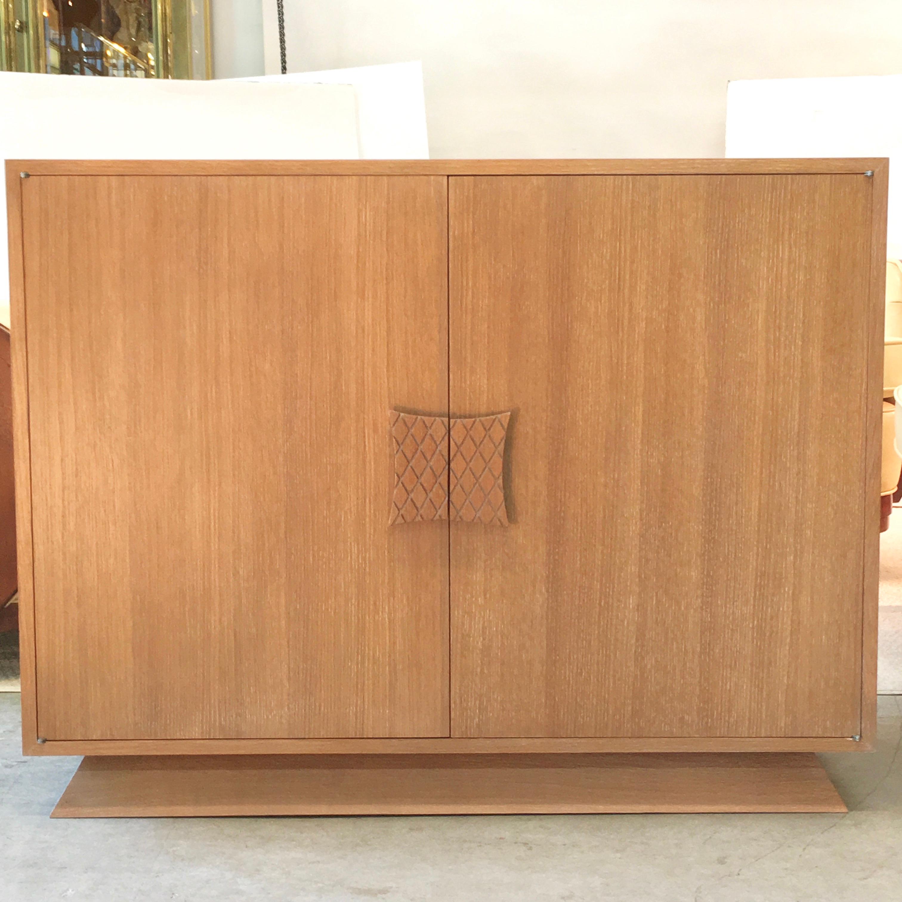 
Presenting BG Galleries' exclusive re-edition of a custom design by Ernst Schwadron and executed in the workshop of Vladimir Kagan's father in 1949.
Two door cabinet of harmonic proportions, constructed of white oak set on a trapezoidal plinth base