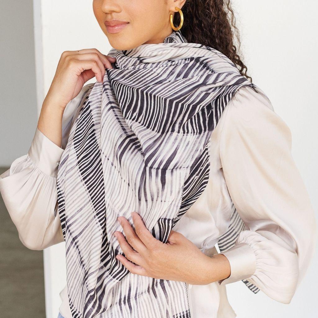 An effortless classic style statement, this beautiful silk scarf, also a perfect mindful gift, is a pure statement piece that adds modern elegance and timeless quality as an accessory which can be used suitably for personal / workwear or as a travel