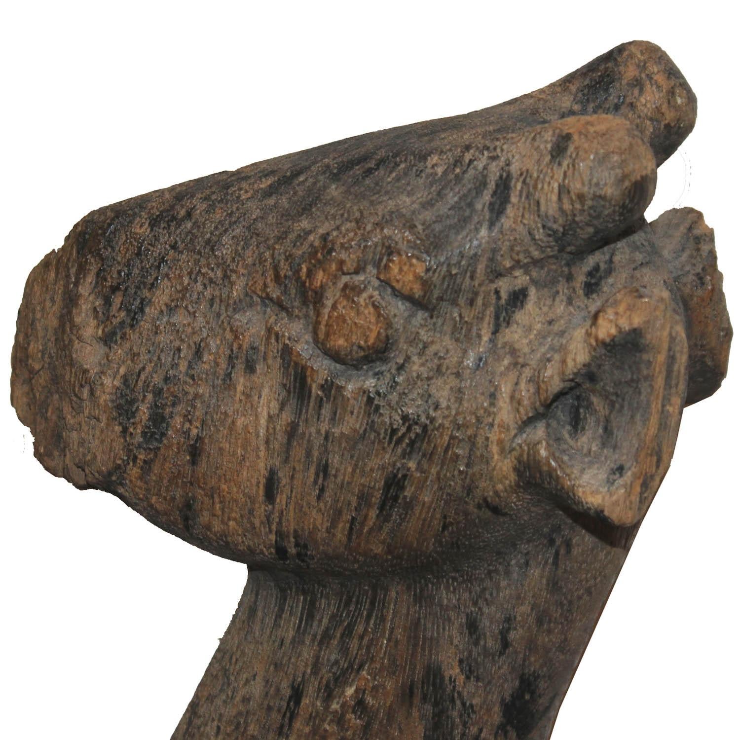 19th century seated wood deer from the Makon Valley in Laos. Hand carved deer, eroded over time, makes an interesting accessory for a bookshelf or coffee table.

