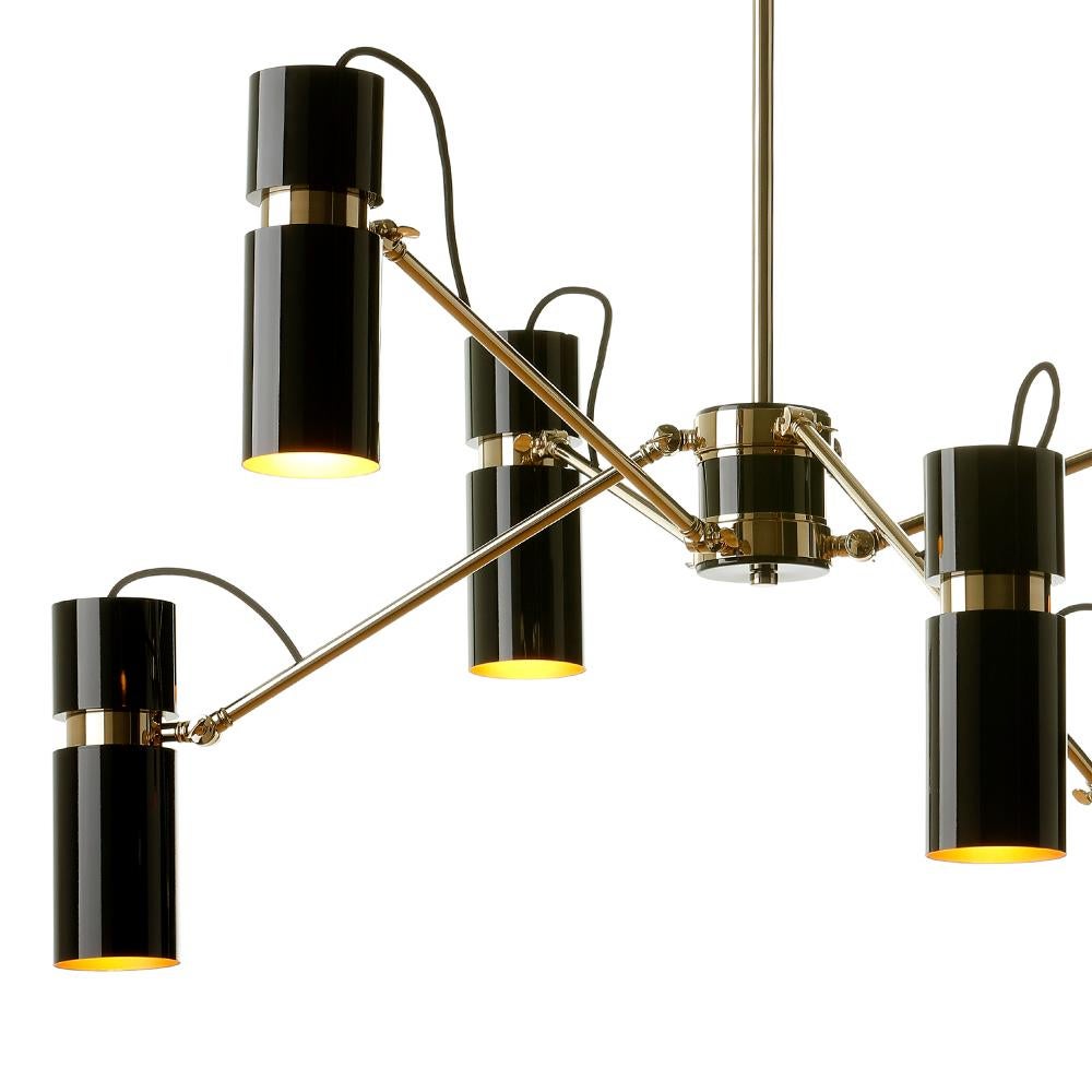 Suspension Eroll with structure in polished brass.
Inside lamp shades in gold finish. With 6 lamp shades
black lacquered outside. With 6 bulbs, lamp holder type 
E14, max 40 watt.
Bulbs not included.