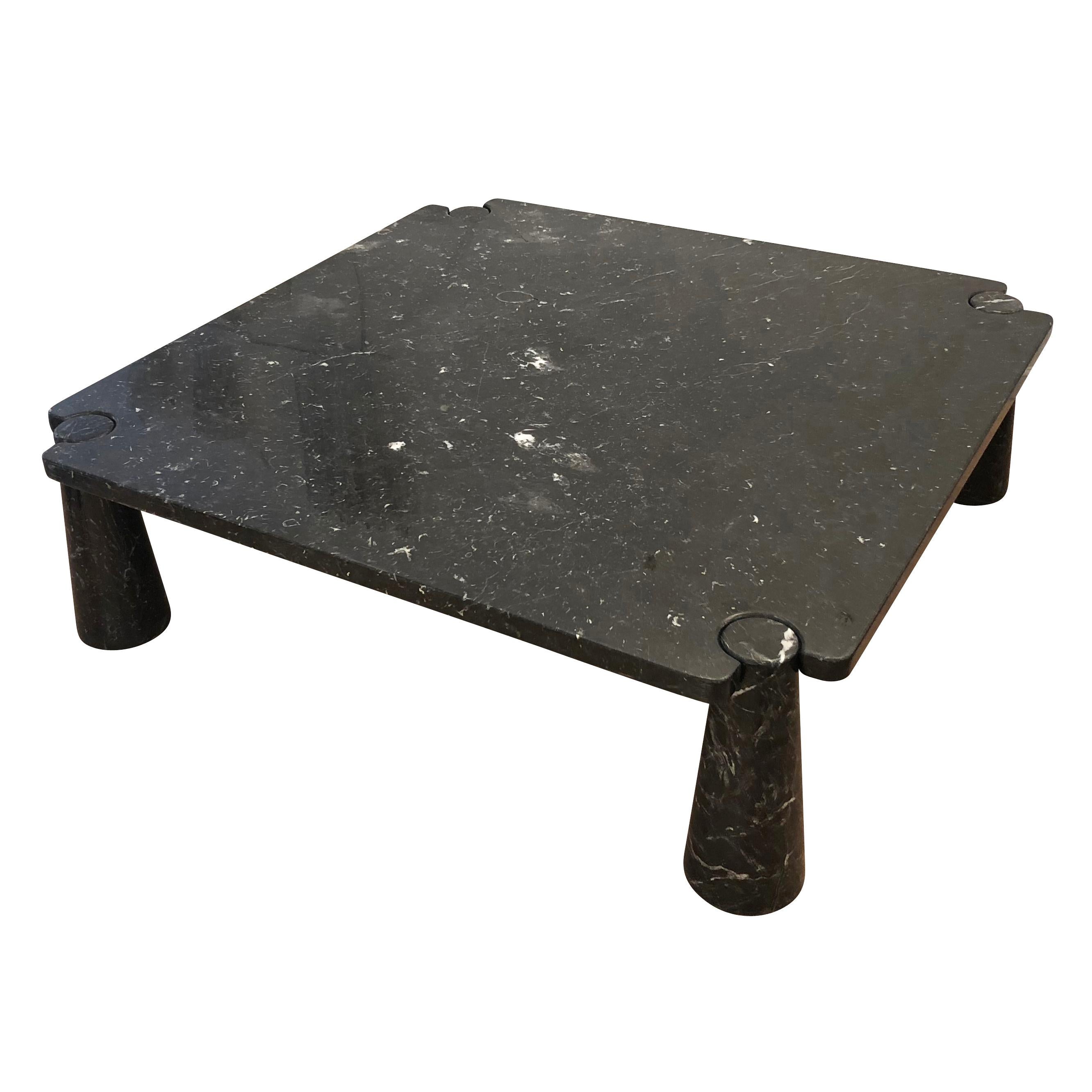Large black marble coffee table designed by Angelo Mangiarotti in 1971. The piece uses the concept of “gravity joints” were the conical legs and top are set and locked in place by the weight of the material itself.

Condition: Good vintage