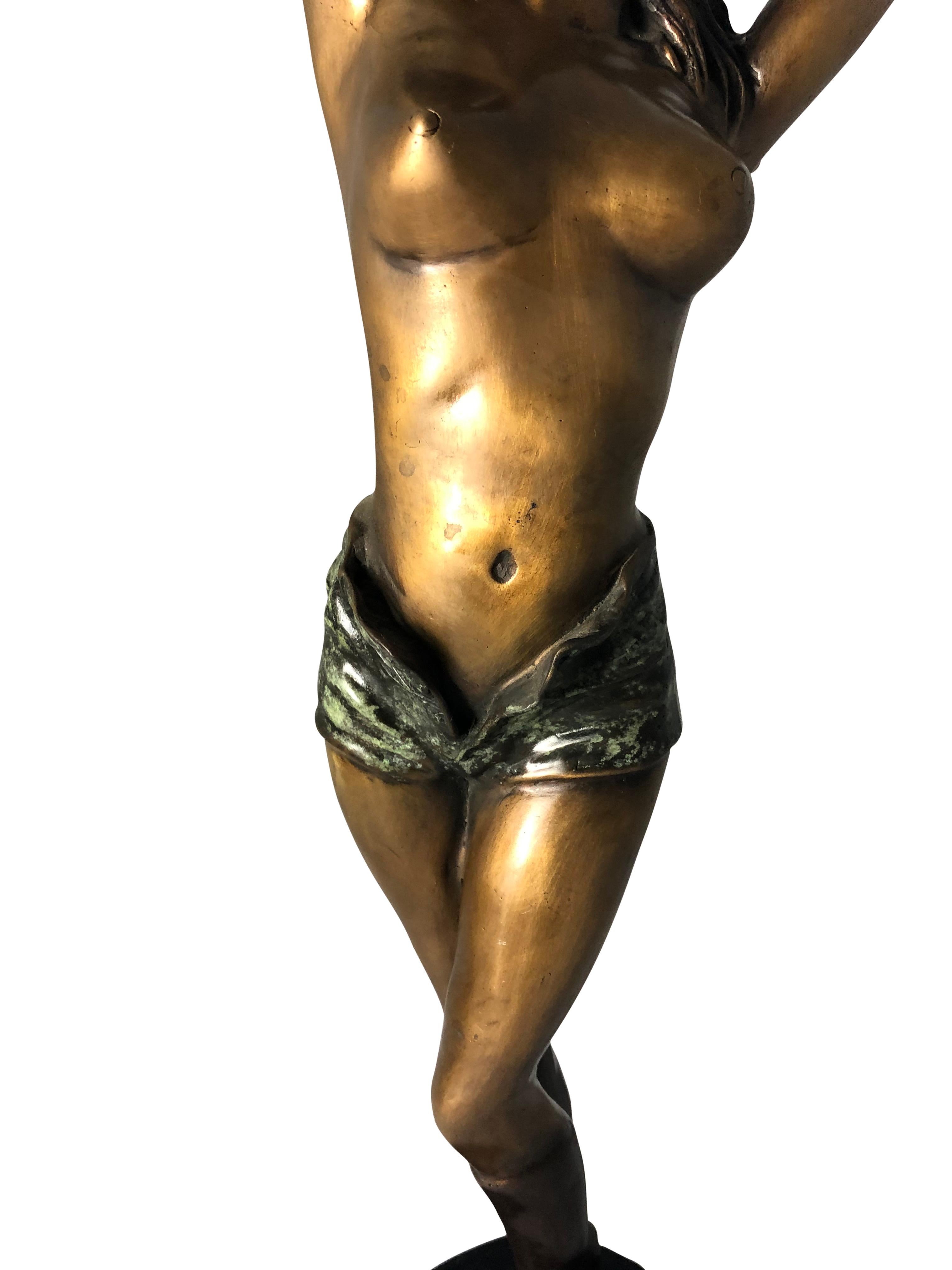 A stunning erotic bronze woman in Art Deco style, 20th century. This woman is offered with a gorgeous emerald green patina to the shorts. Perfect for home furniture and ready for shipping right away.