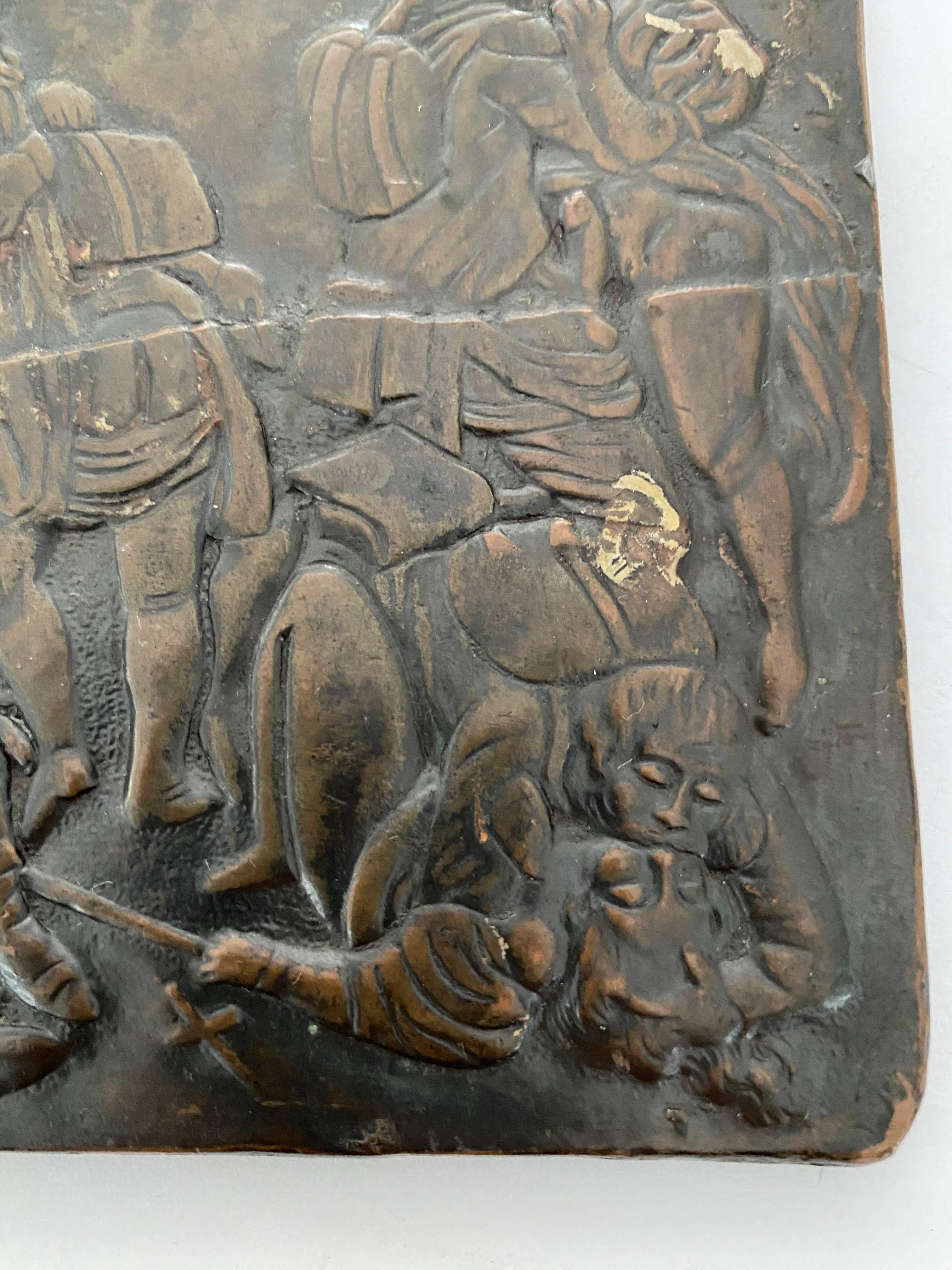 This rare and damaged copper repoussé relief 18 people in erotic play involving French soldiers of various rank and state of undress. The artwork has a horizontal crack across the center of the scene. The relief is backed by a sold bronze panel.