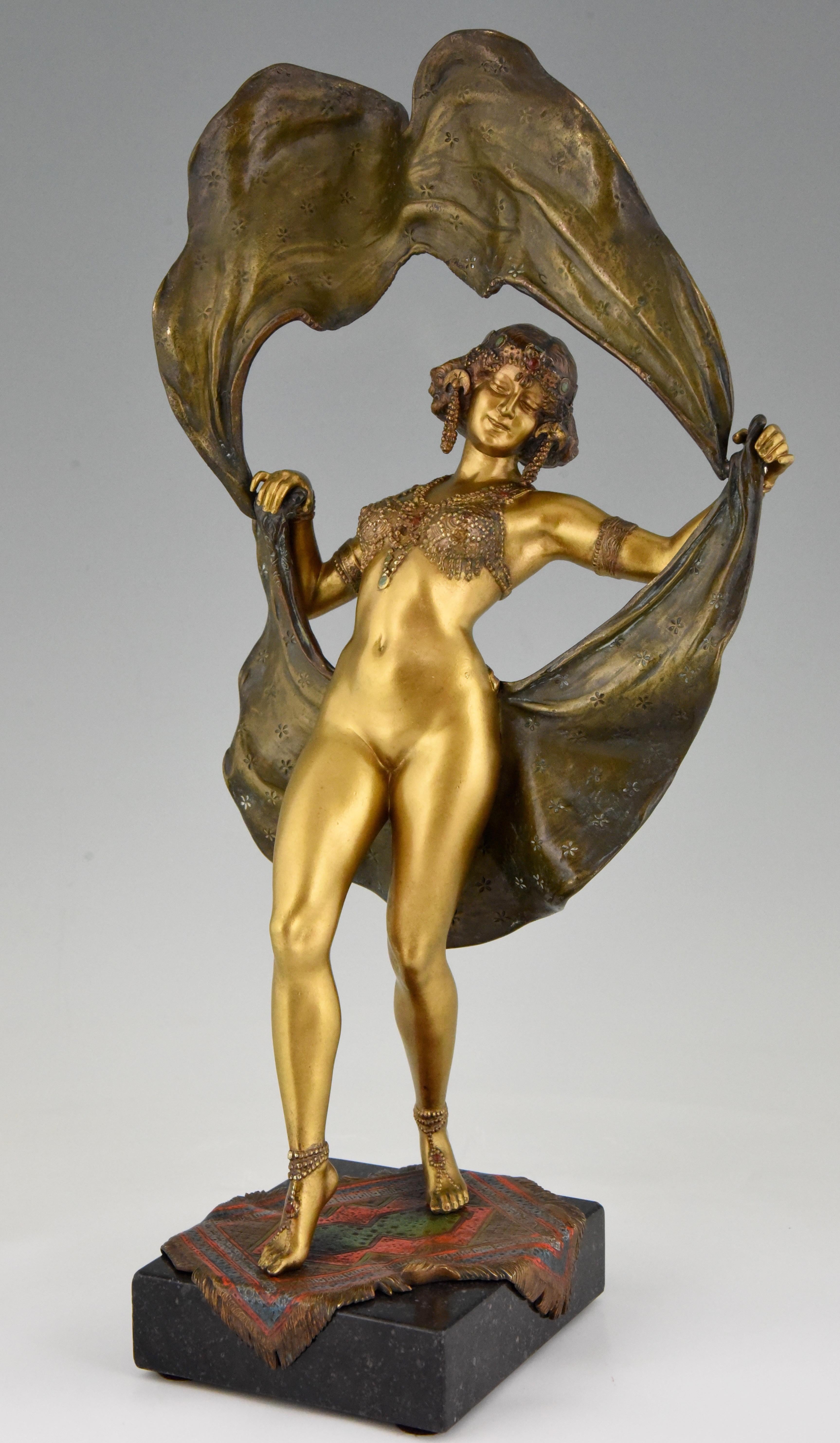 Big windy day, large erotic cold painted mechanical Vienna bronze of an oriental nude dancer. Her skirt lifts to reveal her naked body. 
Signed ‘Nam Greb’ and ‘B’ in a vase.
Cold patined bronze on marble base, Austria, 1910.

This model is