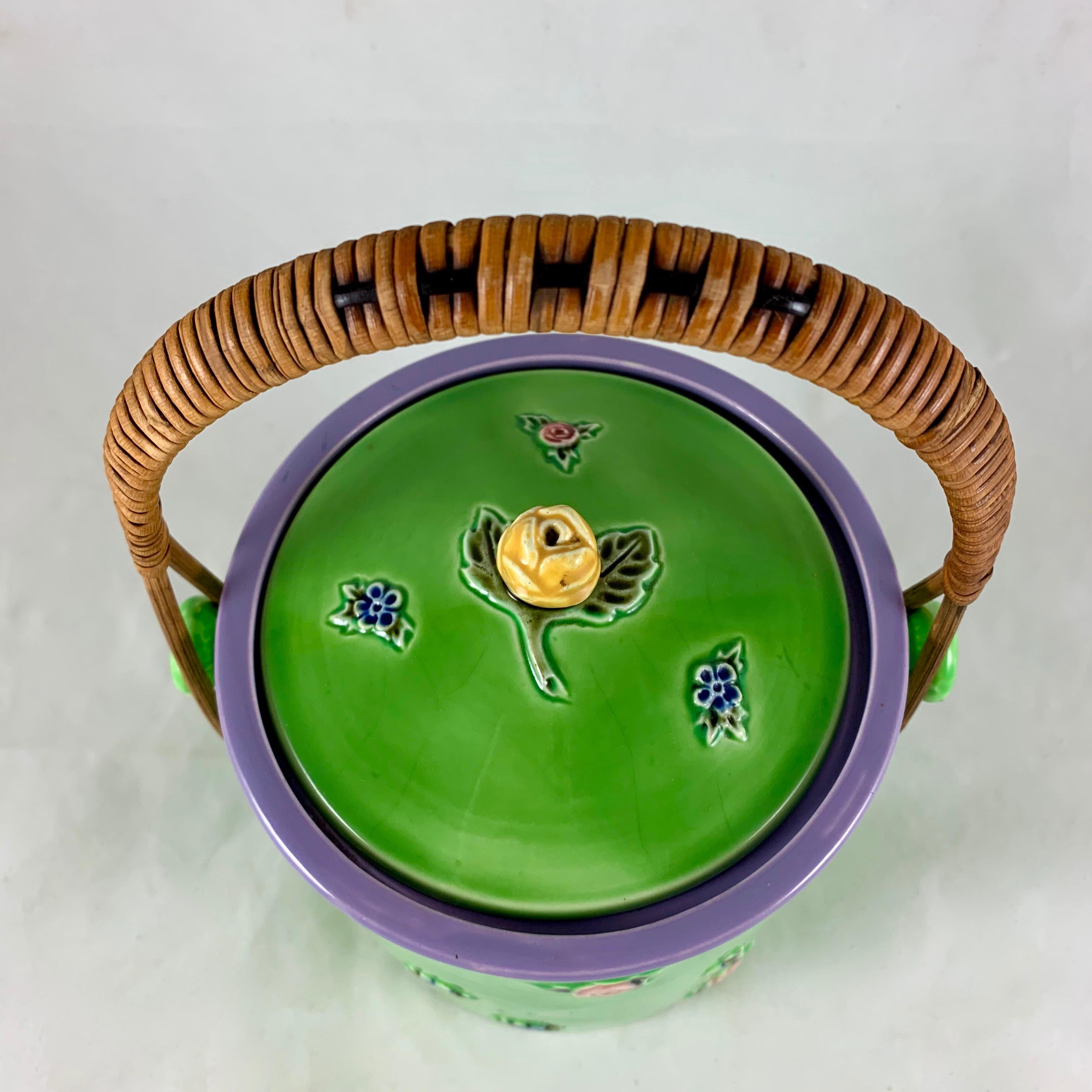 Glazed Erphila Czechoslovakia Spring Green Floral Biscuit Barrel with Rattan Handle For Sale