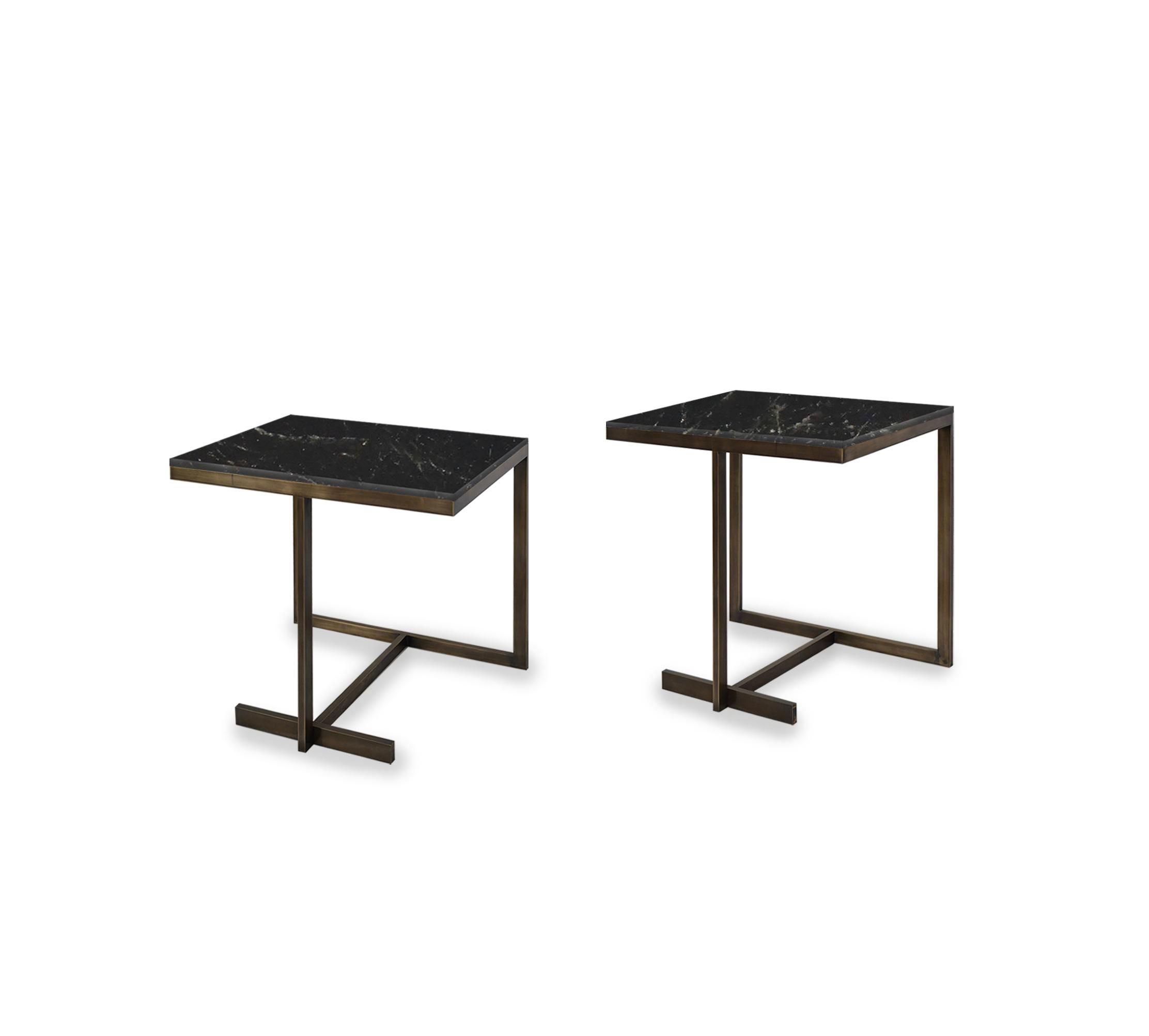 Pair of elegant form side tables with smoky rock crystal tops. Antique brass finish. Created by Phoenix Gallery, NYC. 
Custom size and finish upon request.