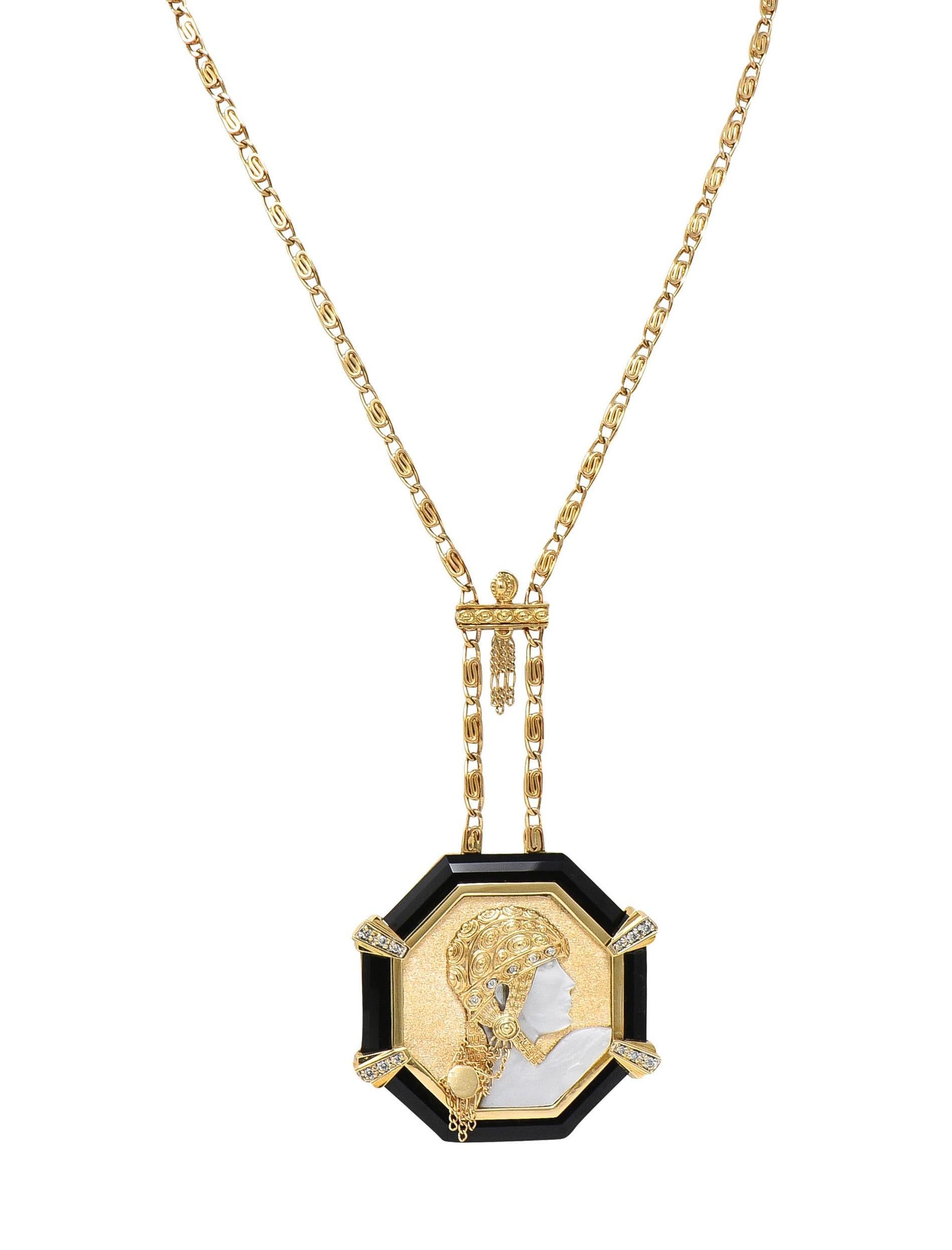 Comprised of a Greek key motif scrolling link chain suspending an octagonal-shaped station
Set below a grooved bar with chain tassel and depicting the portrait of a woman in profile 
Based on Erté's 1919 painting 