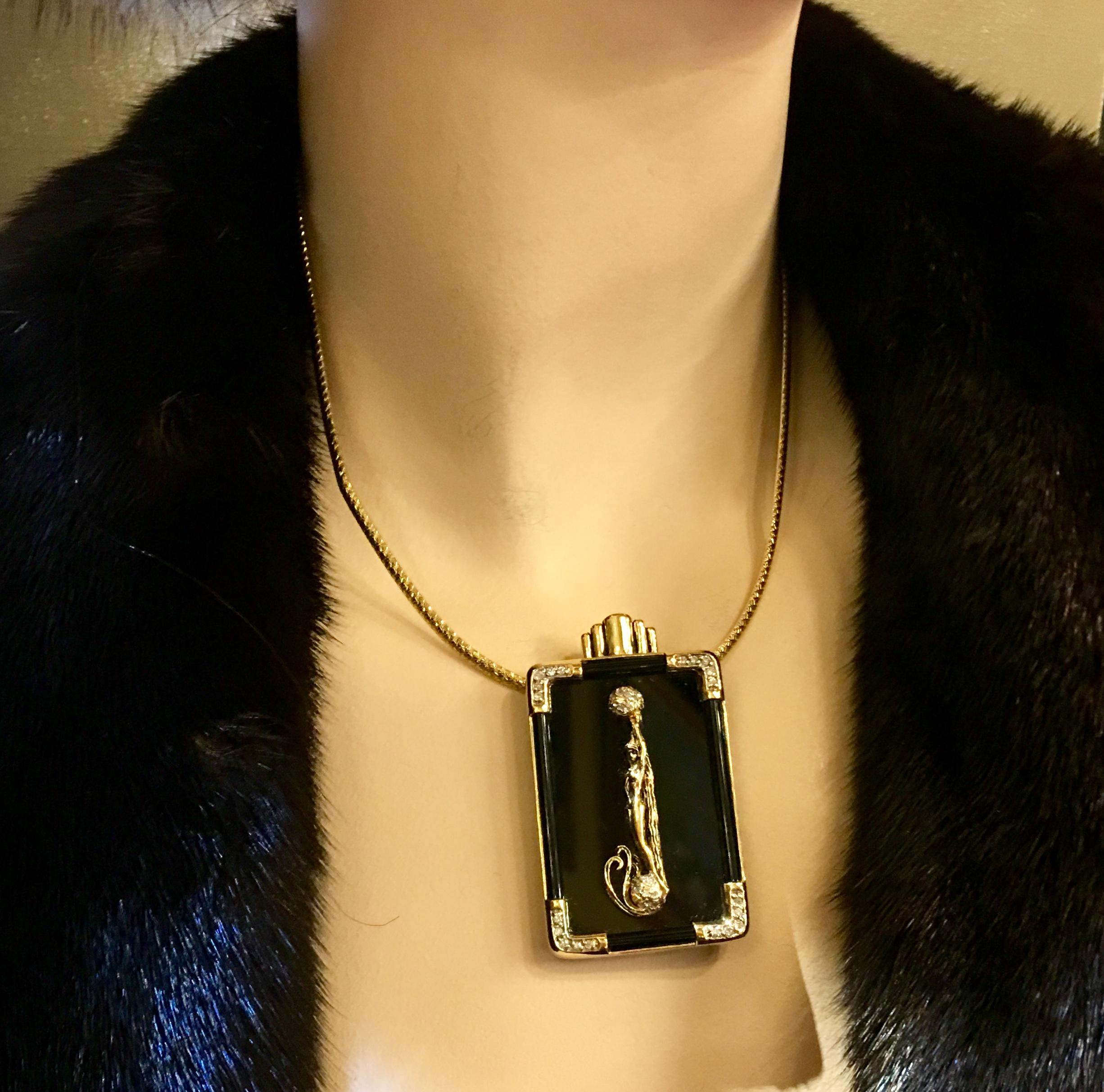 Gorgeous pendant or brooch from Erte, the creator of the Art Deco style, features a black onyx rectangle, bezel set in 14 karat yellow gold with rounded diamond pave corners, with the letter 