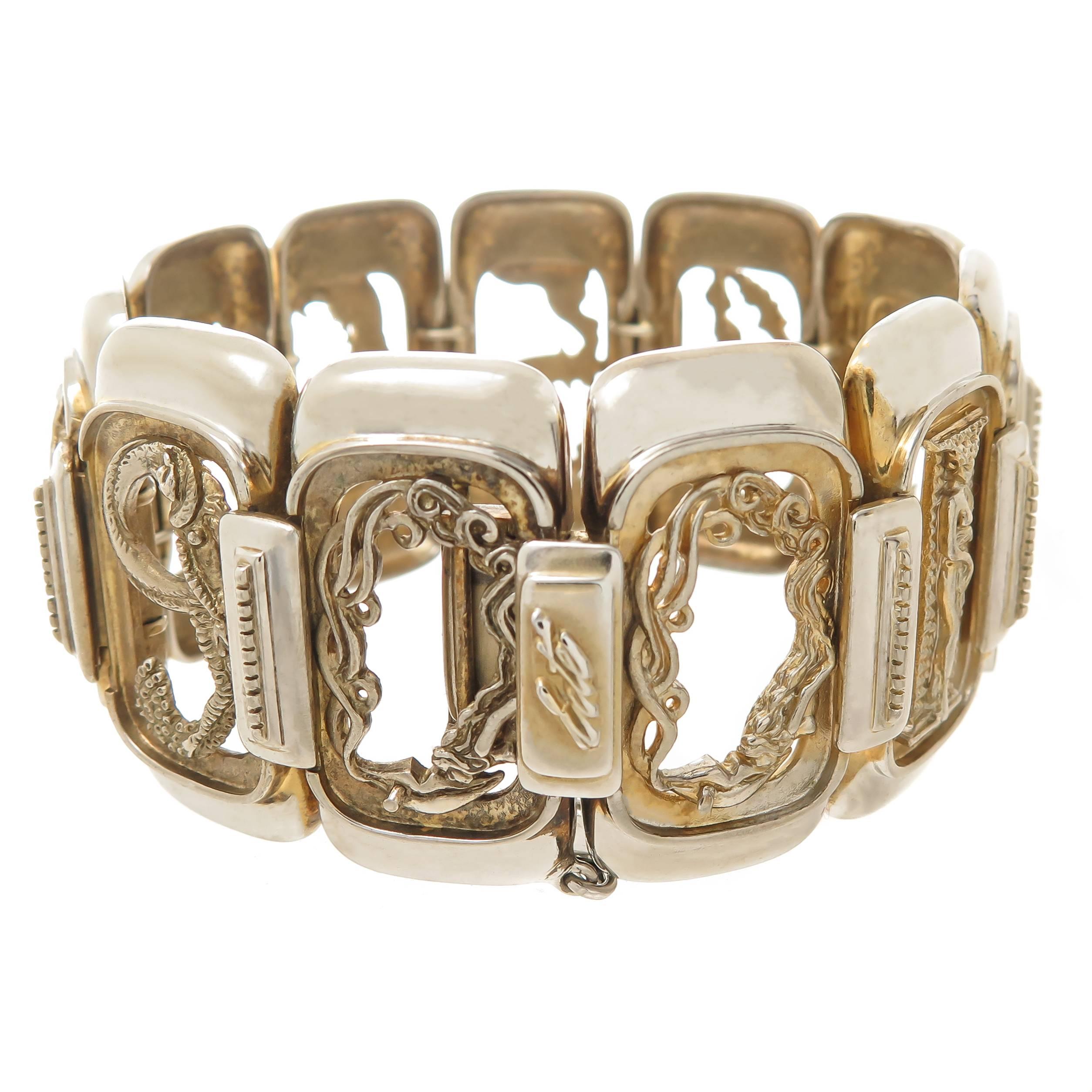 Circa 1980s Erte Sterling Silver Numbers Suite Bracelet in the Famous Erte Art Deco Style, measuring 7 1/2 inch in length and 1 3/8 inch wide. Signed, Numbered and also having the stamp of CFA Circle Fine Art Galleries. Comes in original