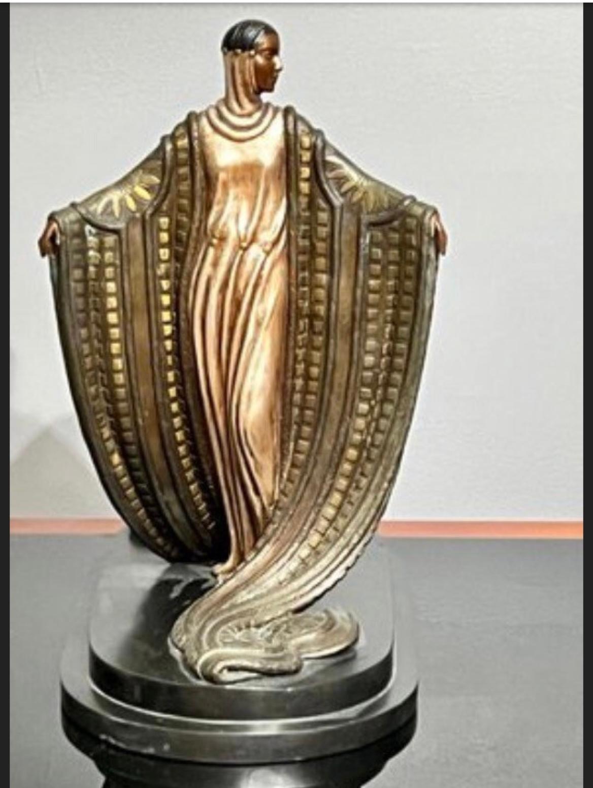 This is an Erte La Mysterieuse Ltd Ed Bronze Sculpture Signed and numbered. In good condition some patina due to age. 15 1/4”(L) x 8 1/2”(W) x 15”(H)