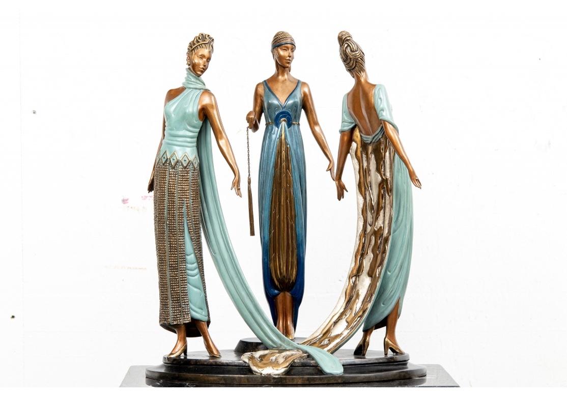 Signed on the top back of the base, labeled on the base edge- 210/375, JM Fine Art Acquisitions 1987.
An elegant trio of the Graces wearing colored gilt patterned gowns and one with a long gilt train in back. Stylish and very well made custom black