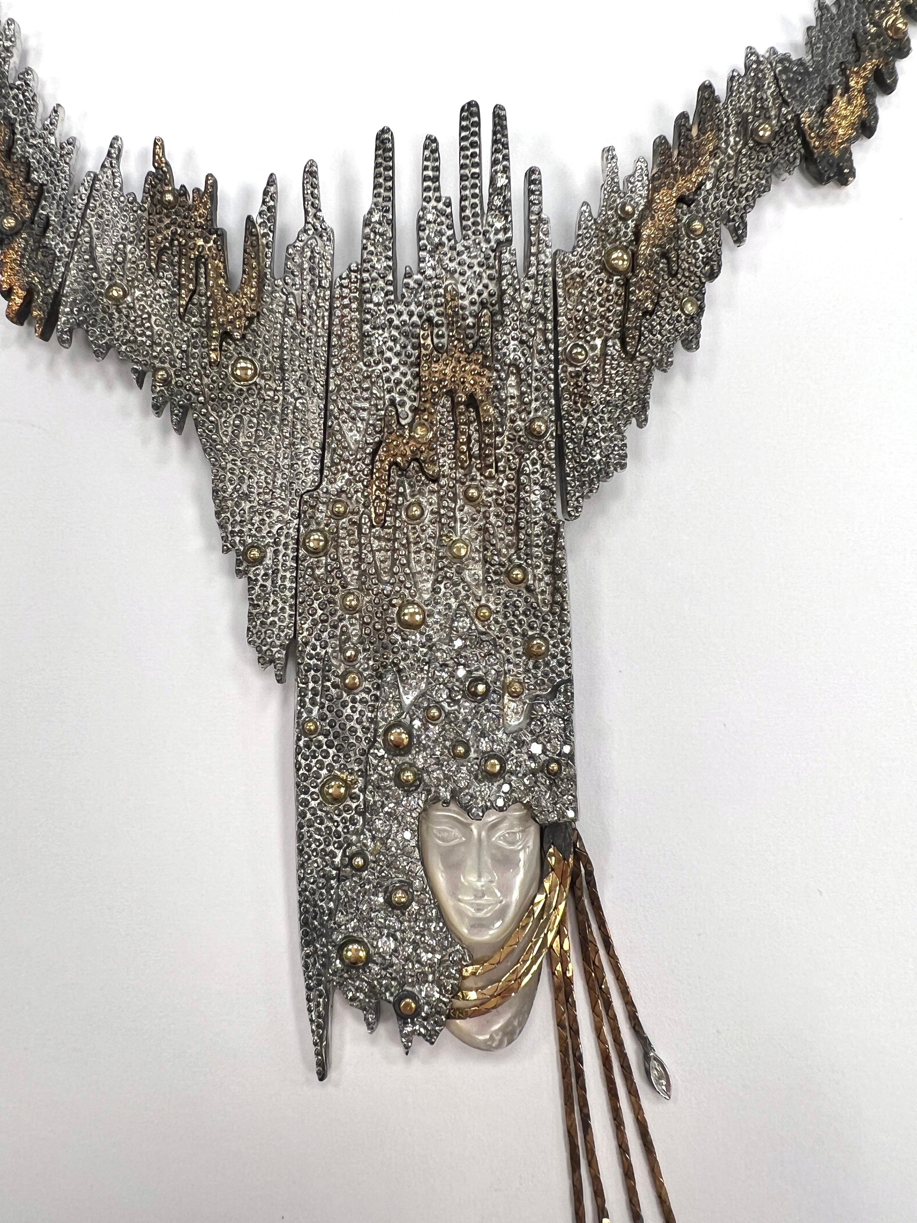 Extraordinary 1970s–1980s Brutalist Artisan Necklace with Carved Pearl Face & Mixed Metals

A stunning and rare example of late 20th-century wearable art, this one-of-a-kind statement necklace exemplifies the bold creativity of the Brutalist and