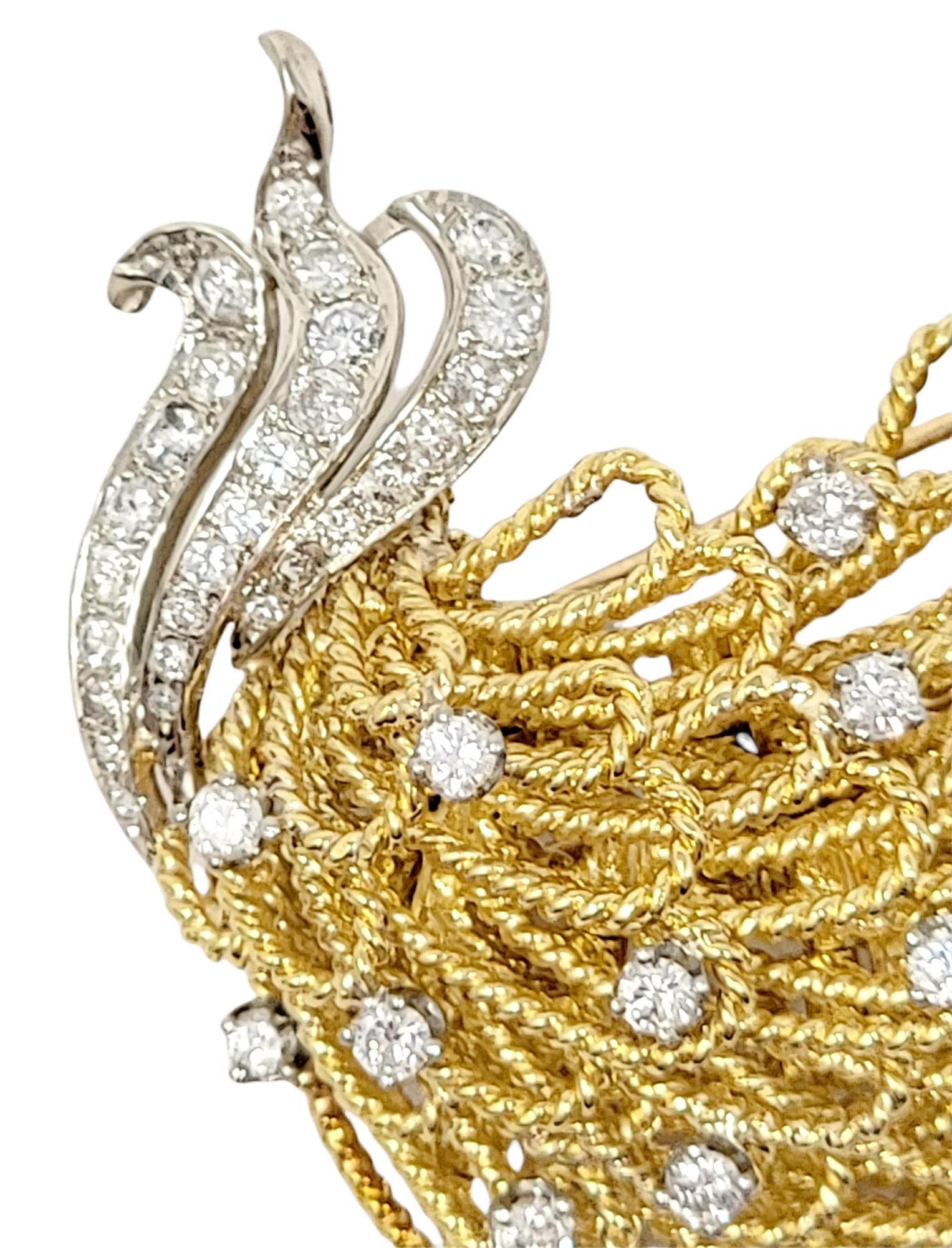 Absolutely exquisite diamond and 18 karat yellow gold peacock motif brooch / hatpin by Erwin Pearl. This beautifully detailed piece is accented by incredible sparkling diamonds that shimmer throughout. The stunning brooch features multiple layers of