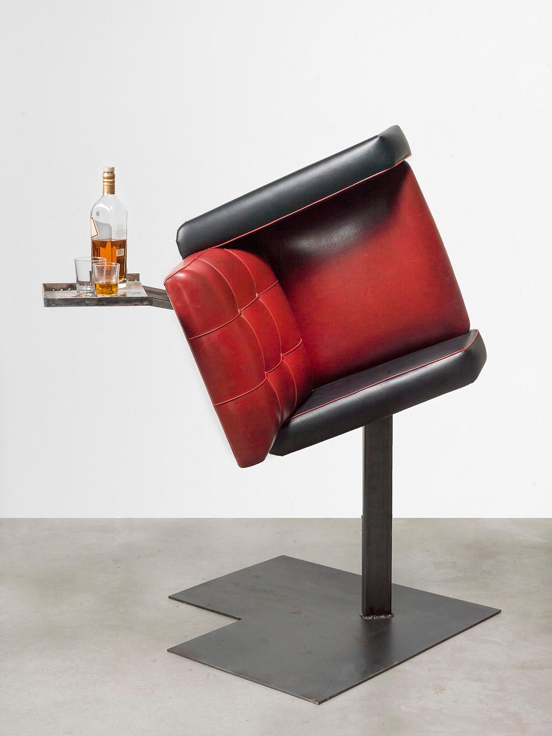 Erwin Wurm's Drinking Sculptures are an expansion of his One Minute Sculpture series. These performative works consist of vintage furniture mounted onto bronze sculptures - cucumbers and like forms - turned into bars on which various spirits and