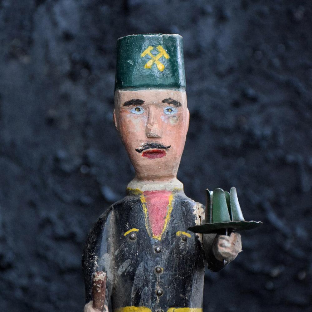 Erzgebirge German folk-art candle holder figure
A rare early 20th century hand carved folk-art Erzgebirge German miner soldier candle holder figure. made from pine and still with all its original first paint all intact, holding a toleware tin