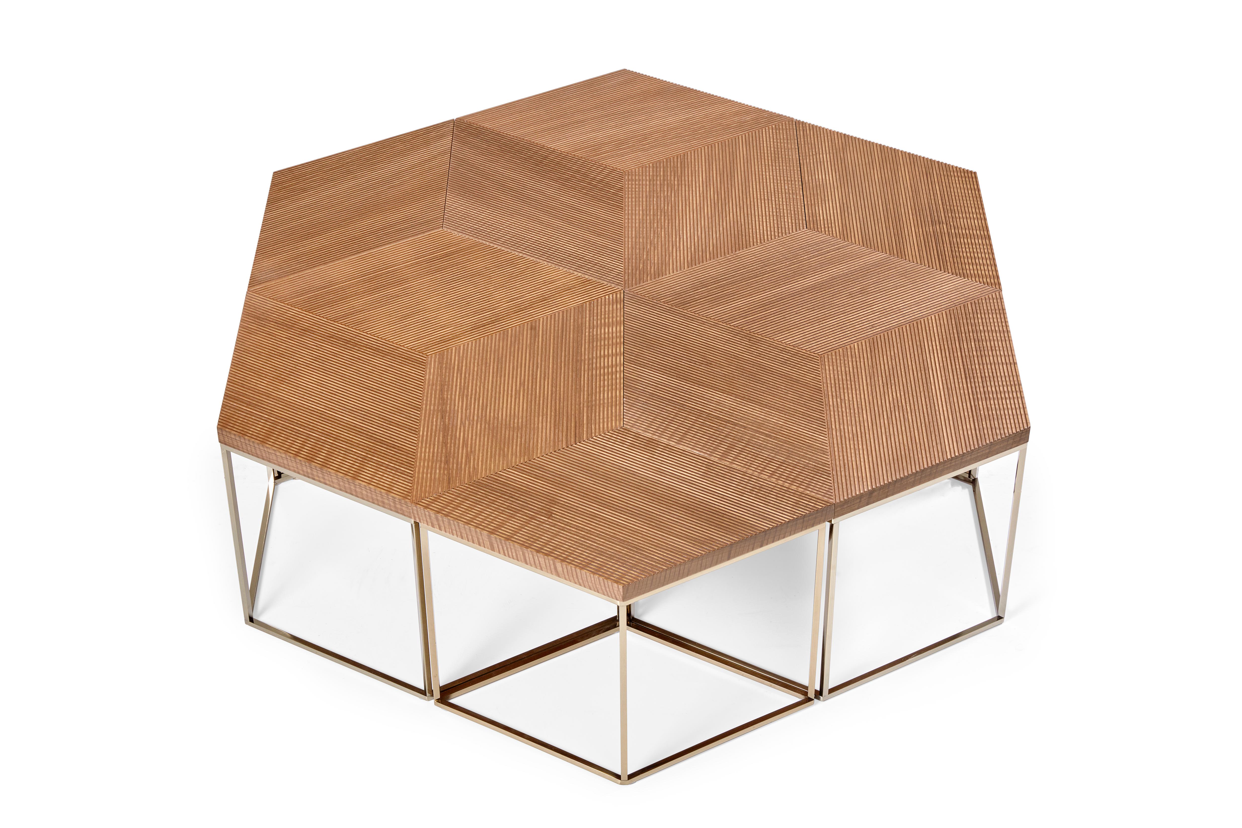 Flexibility is key with this modular coffee table that has multiple configuration options for ease of use in large or small spaces. Featuring a geometric wood top on slim metal legs, these pieces are light in weight for ease of movement.