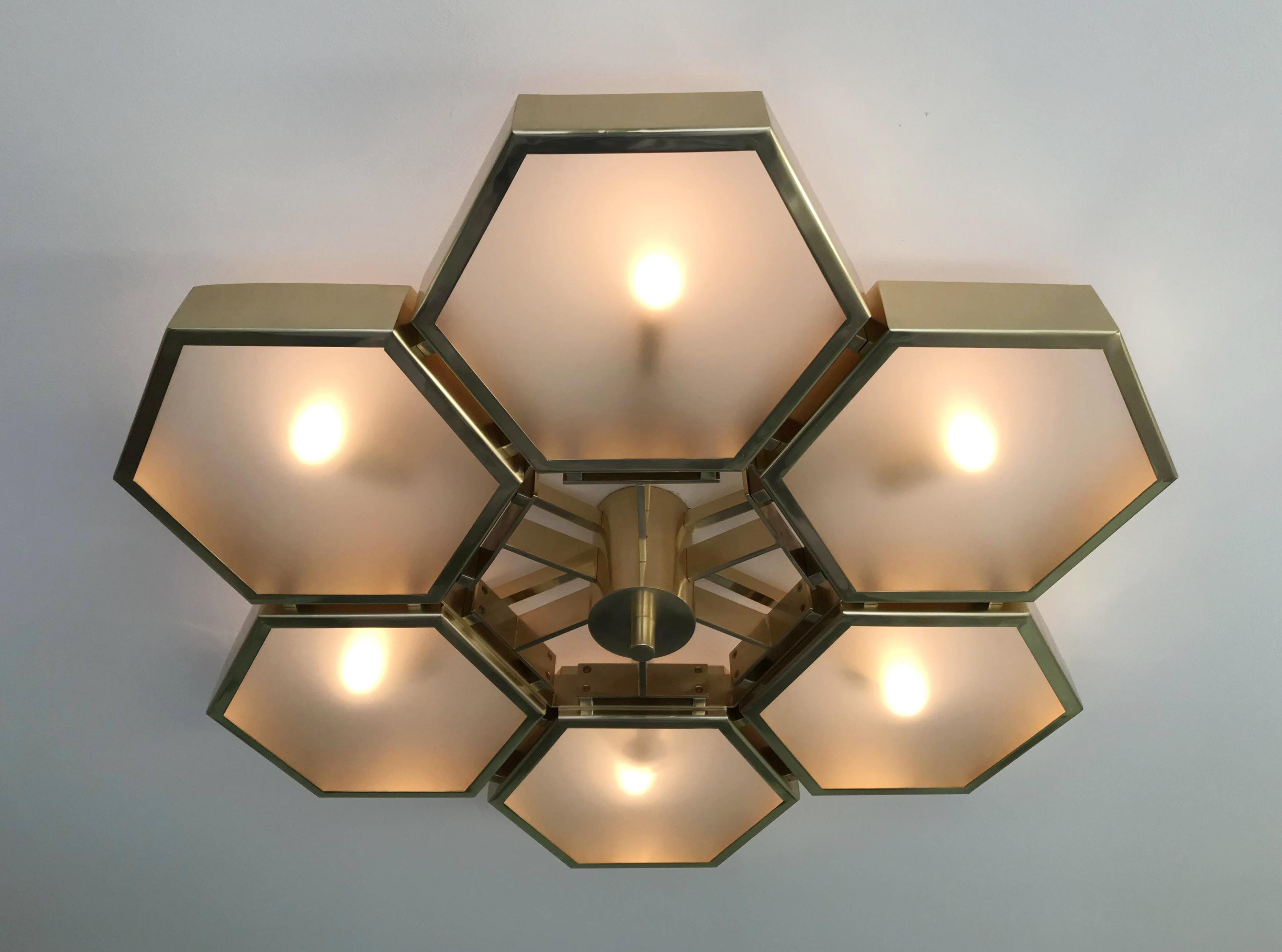 Impressive Italian flush mount with 6 hexagonal satin glass diffusers, mounted on thick hexagonal brass cells in natural lacquered finish, designed by Fabio Bergomi for Fabio Ltd / Made in Italy
6 lights / E12 or E14 type / max 40W each
Measures: