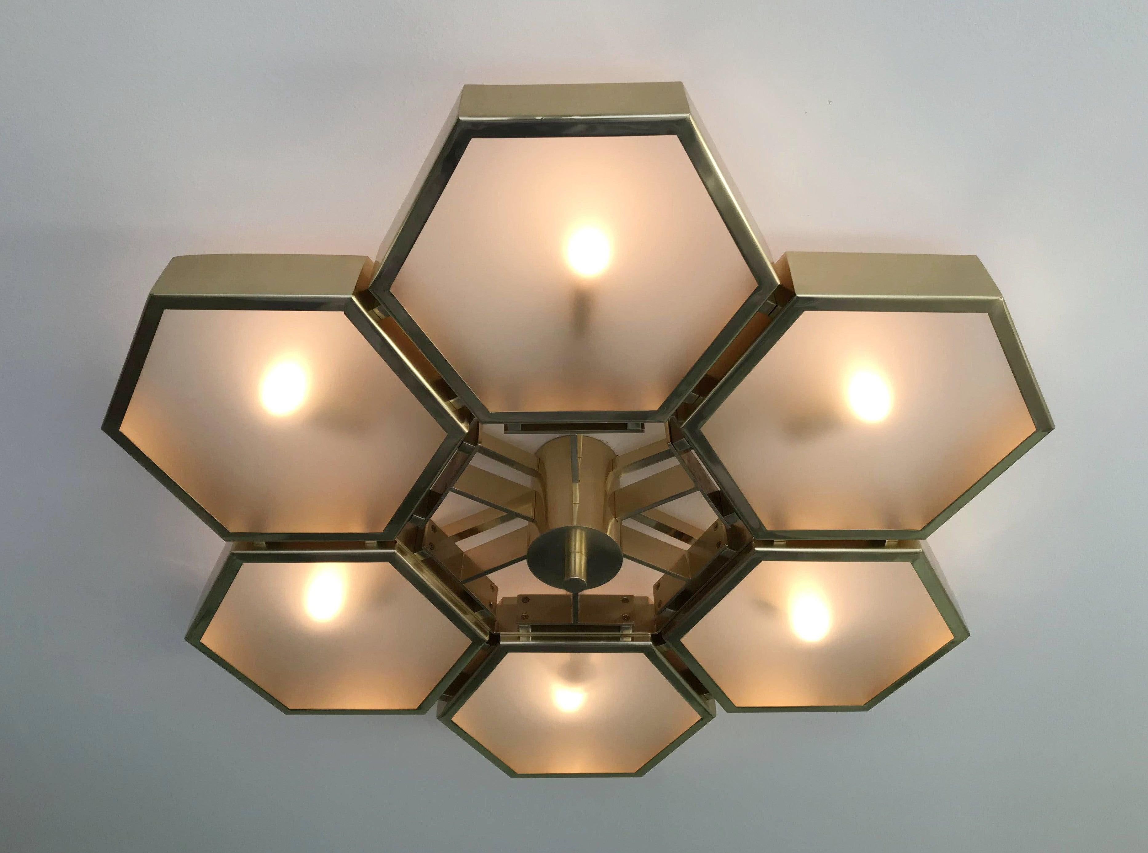 Impressive Italian flushmount with 6 hexagonal satin glass diffusers, mounted on thick hexagonal brass cells in natural lacquered finish, designed by Fabio Bergomi for Fabio Ltd / Made in Italy
6 lights / E12 or E14 type / max 40W each
Measures: