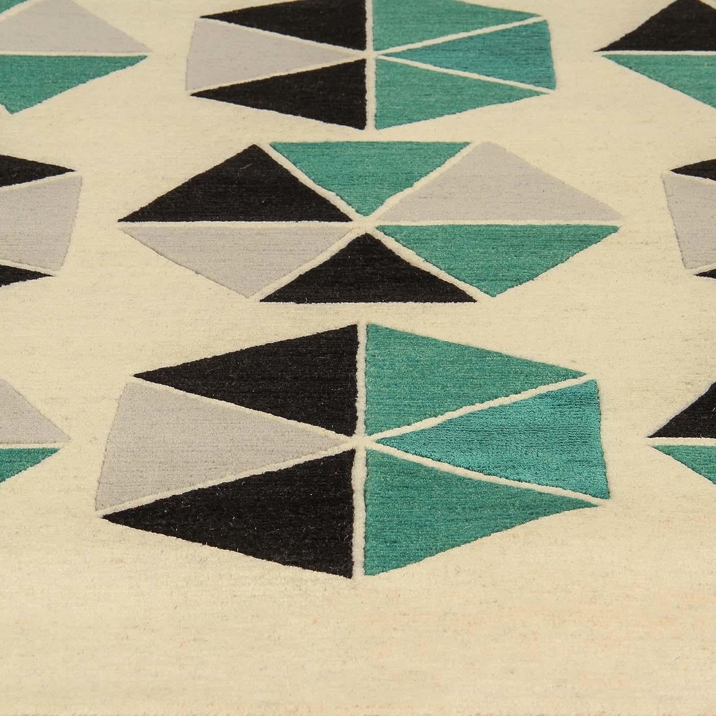A fun and playful carpet inspired by a Gio Ponti’s design. Entirely hand spun and hand carded, this Tibetan wool and natural silk carpet (300 x 250cm) adds harmony and a sense of proportion struck by the perfect balance between design, shape and