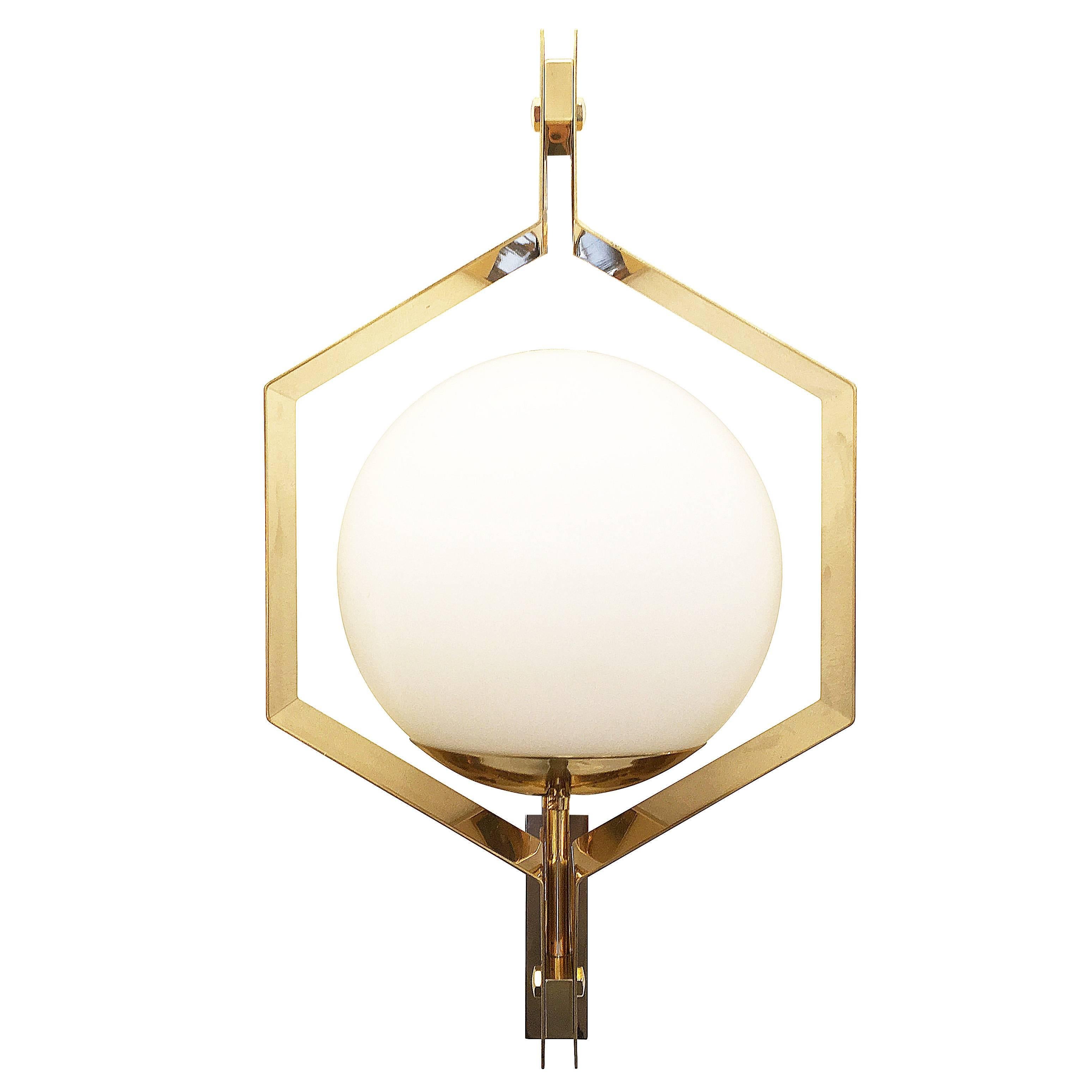 Esagono wall light designed in collaboration with Italian artist Fedele Papagni for our contemporary line, formA by Gaspare Asaro. Features a frosted glass sphere encased by a hexagonal brass frame. Available to order in the finish of your choice.